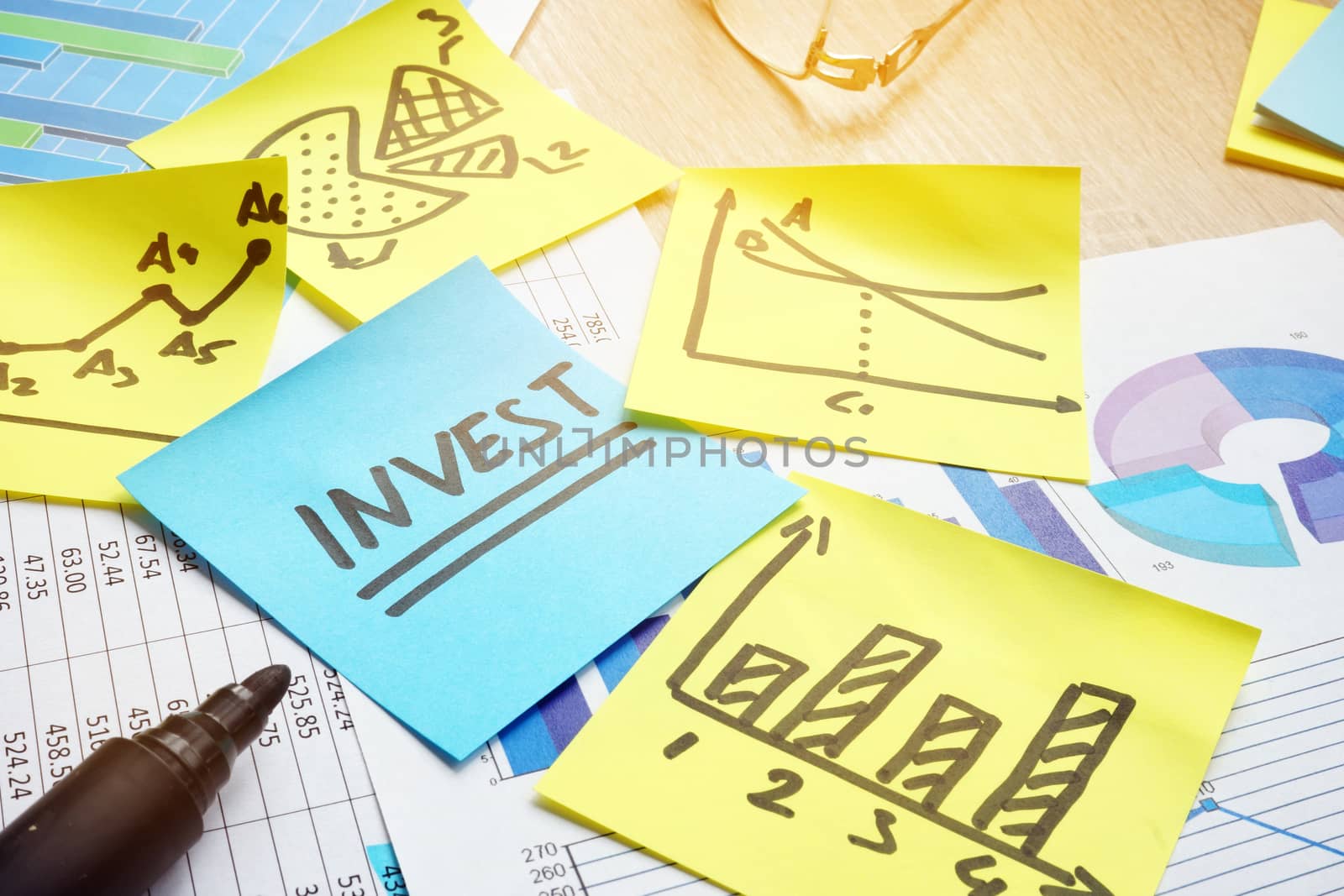 Word invest and financial charts. Return on investment.