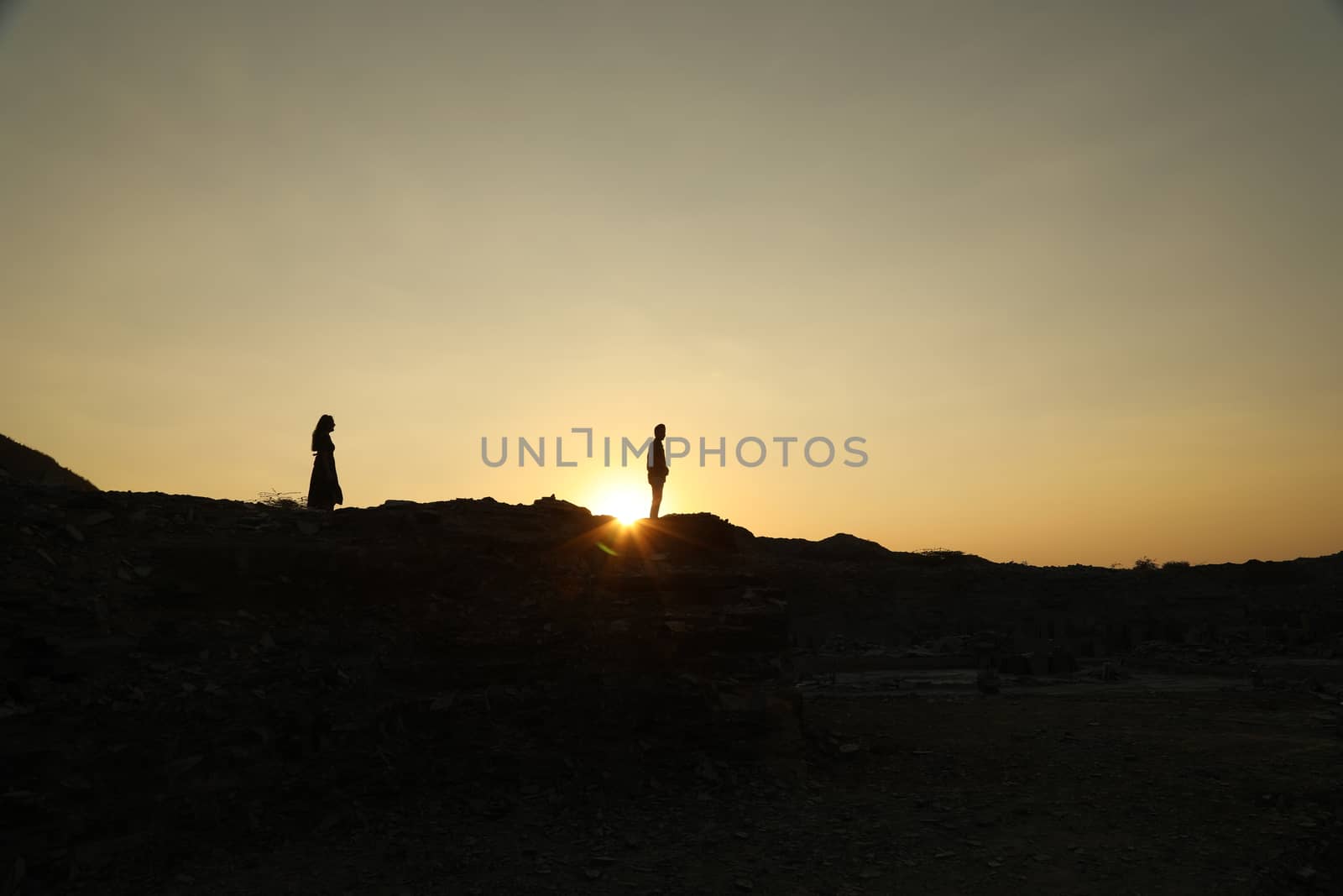 Silhouette of people on hill