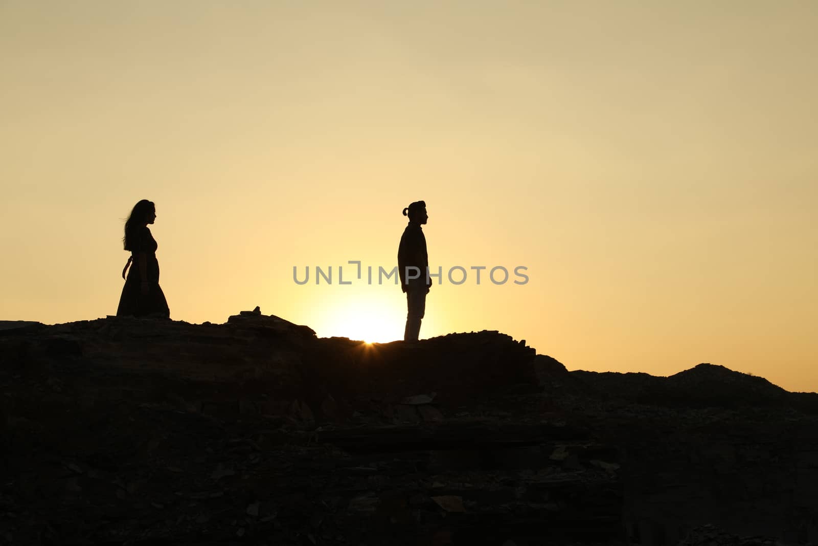 Silhouette of people on hill