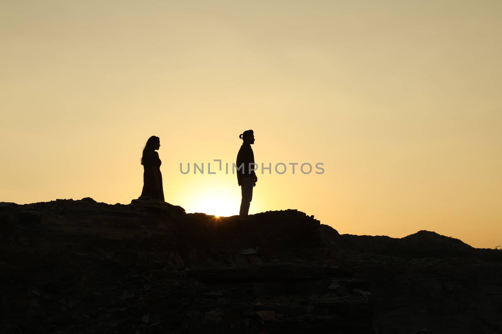 Silhouette of people on hill