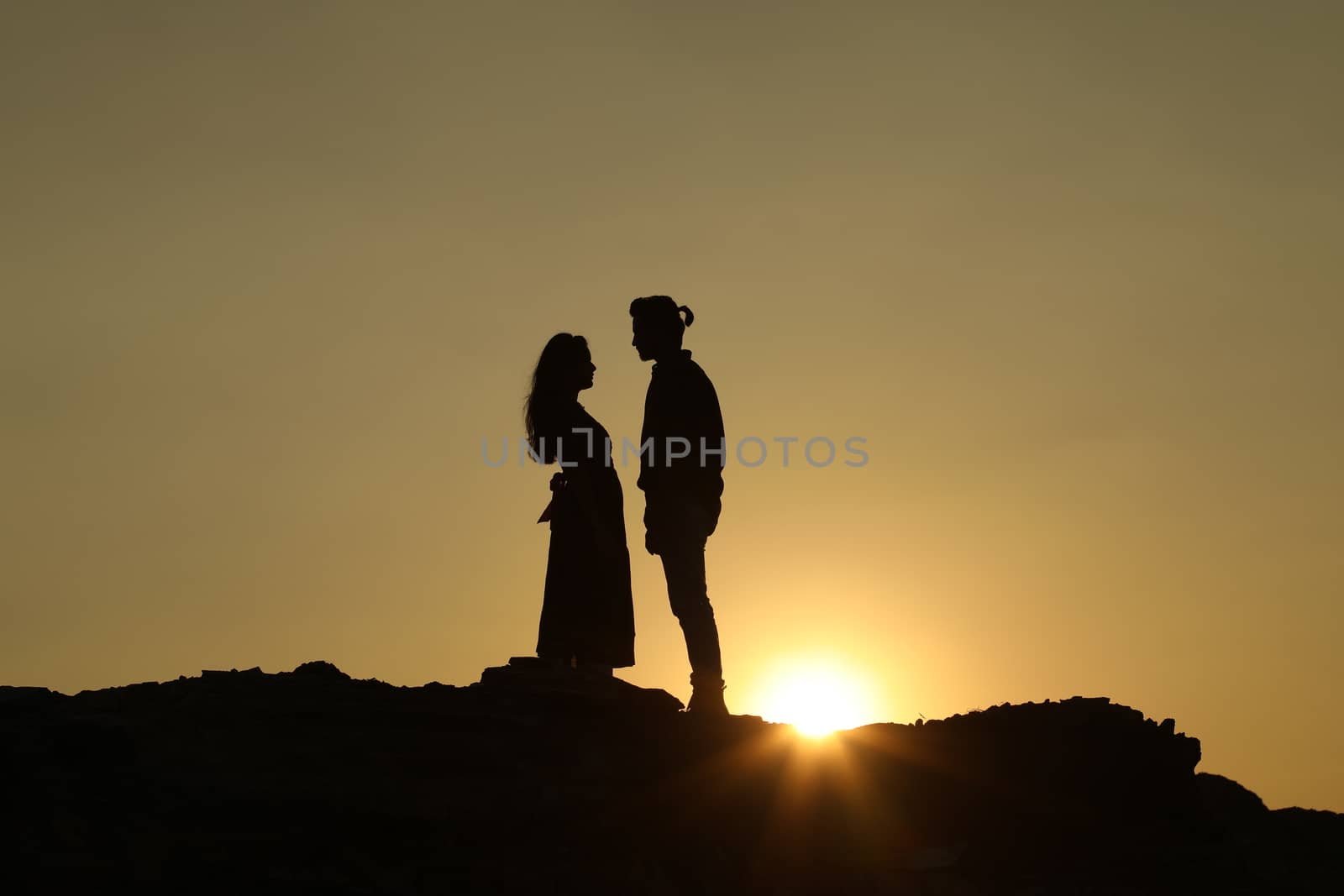Silhouette of people on hill
