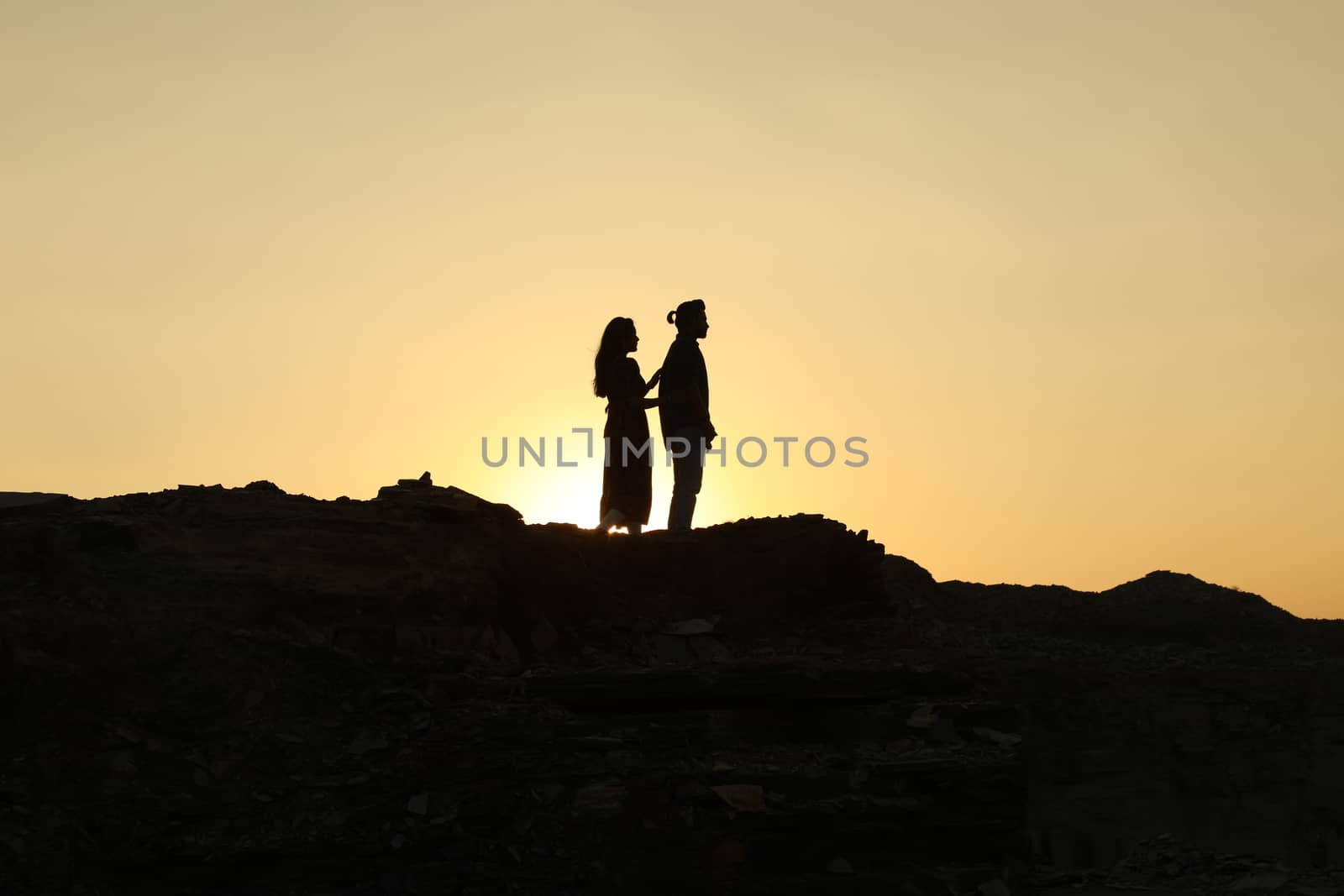 Silhouette of people on hill