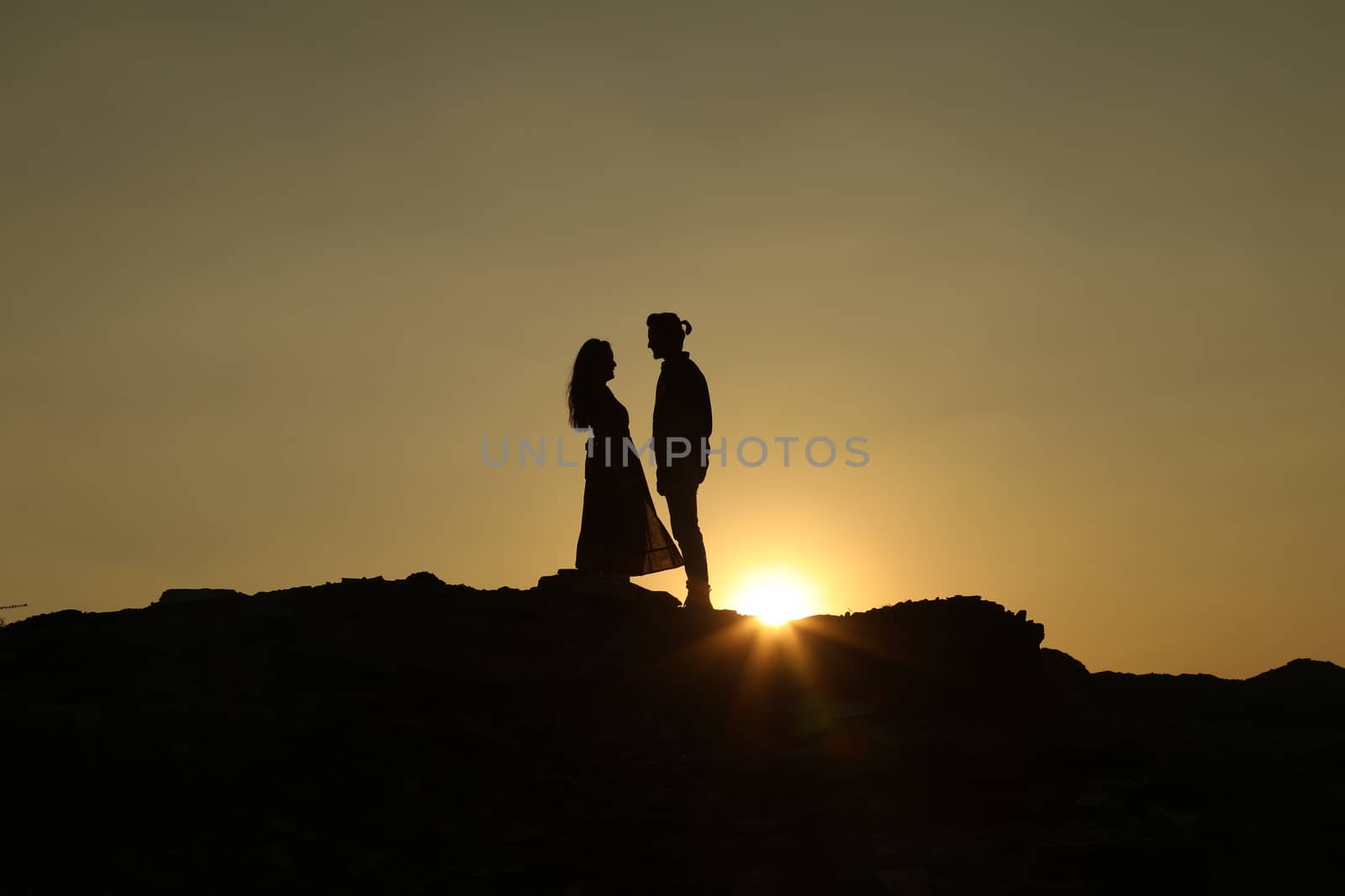 Silhouette of people on hill