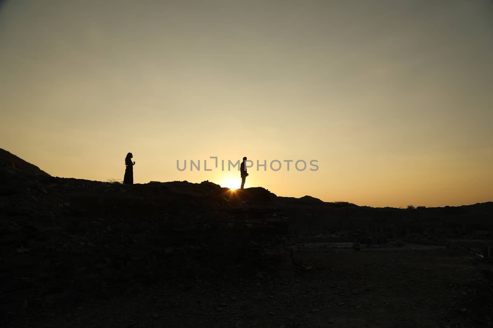 Silhouette of people on hill