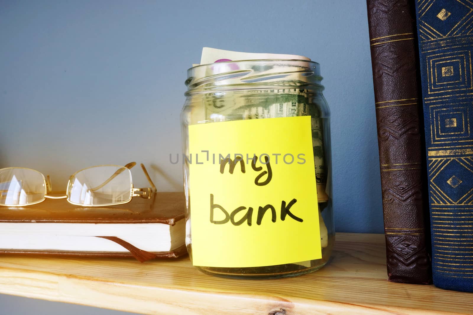 Jar with sign my bank and dollar bills. Savings concept.