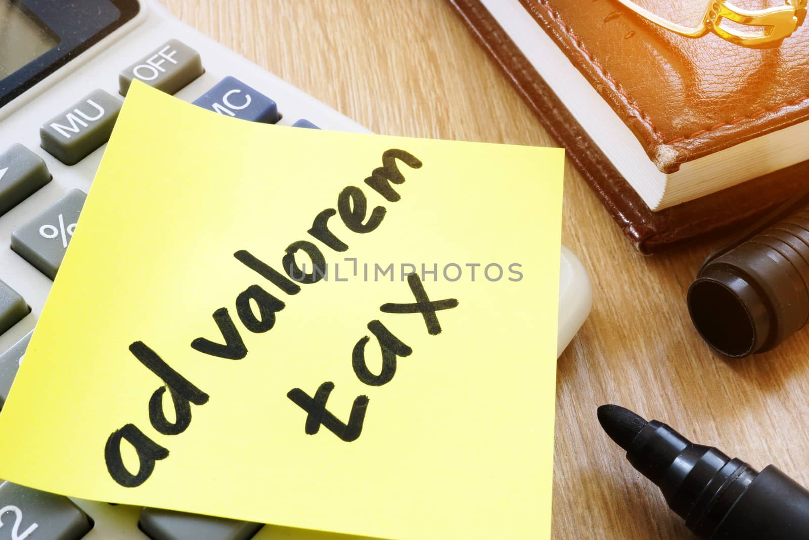 Memo stick with words ad valorem tax.