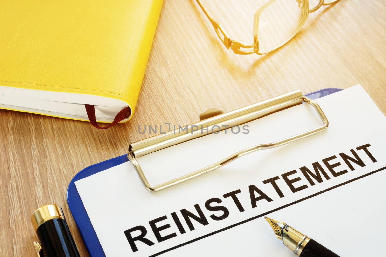Reinstatement on a clipboard and a pen.
