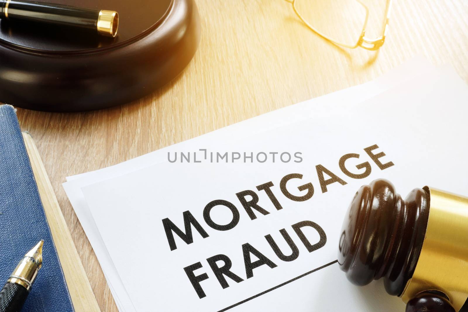 Documents about Mortgage fraud and gavel in a court.