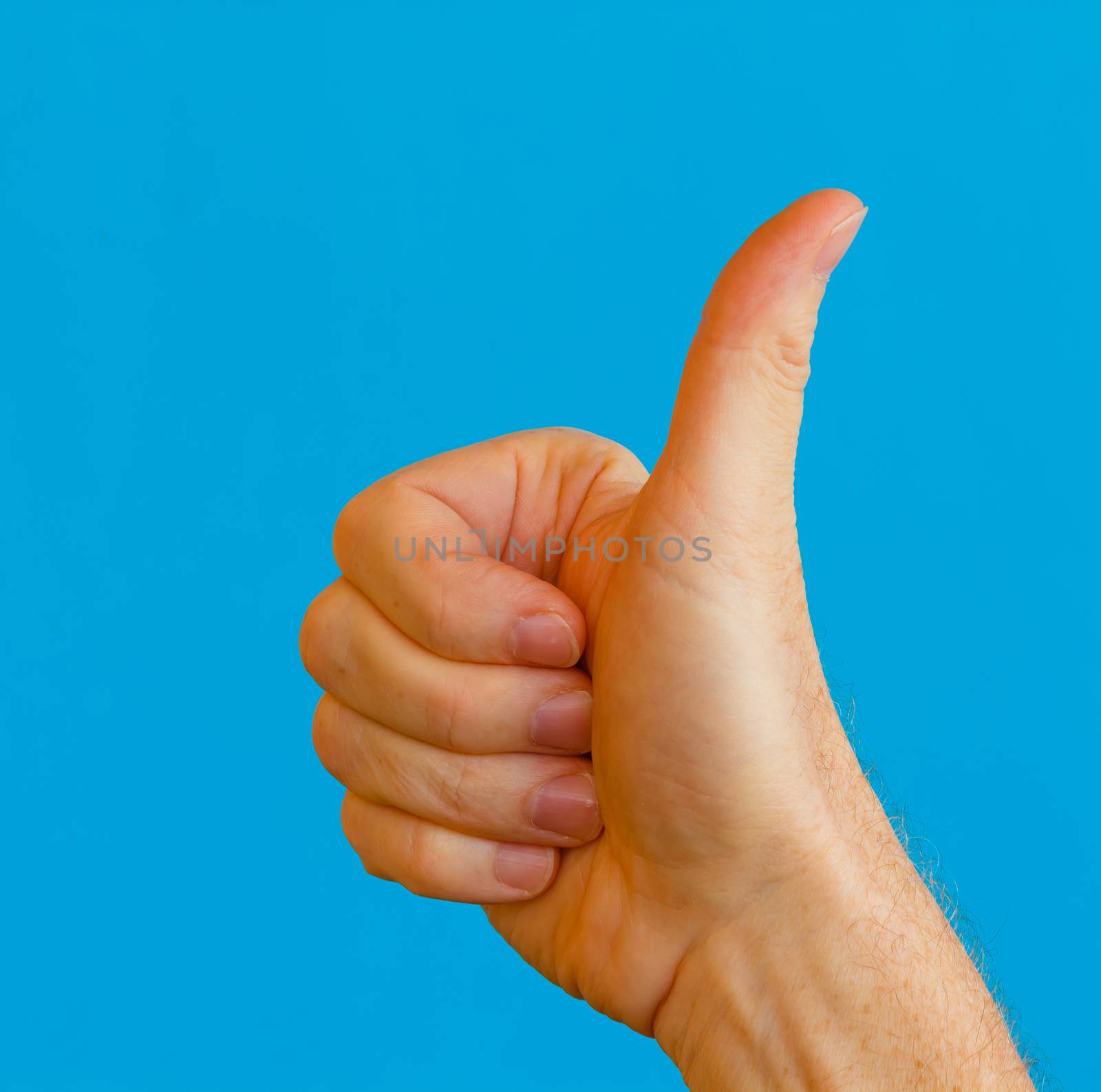 the gesture of the hand of the thumb upwards  to express the meaning of approval