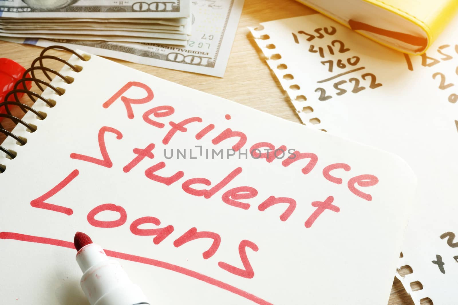 Refinance Student Loans form on a desk.