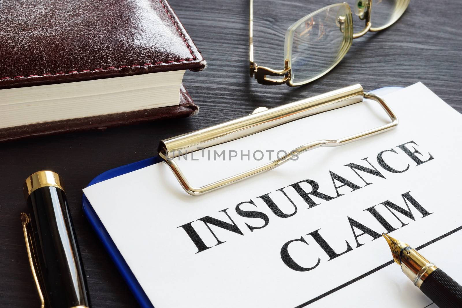 Insurance claim form and pen in the agency.