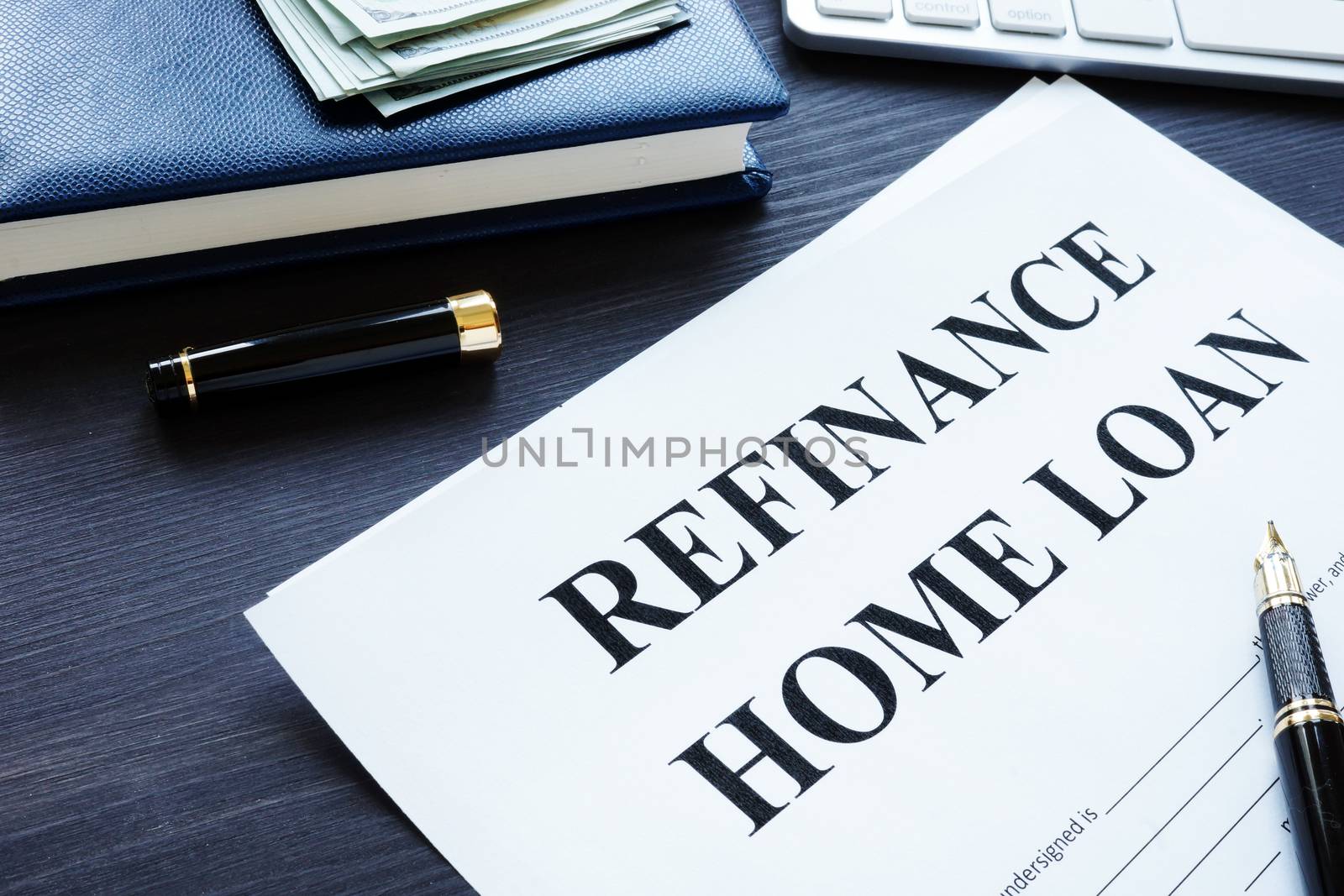 Refinance home loan form, pen and money.