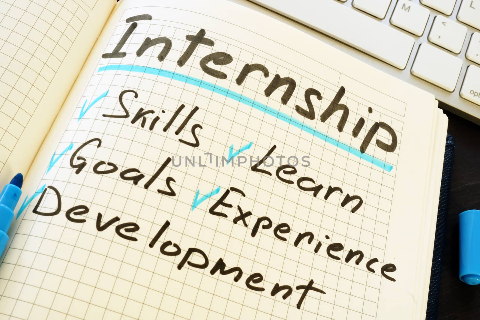 Internship and list of pros written in the notepad.