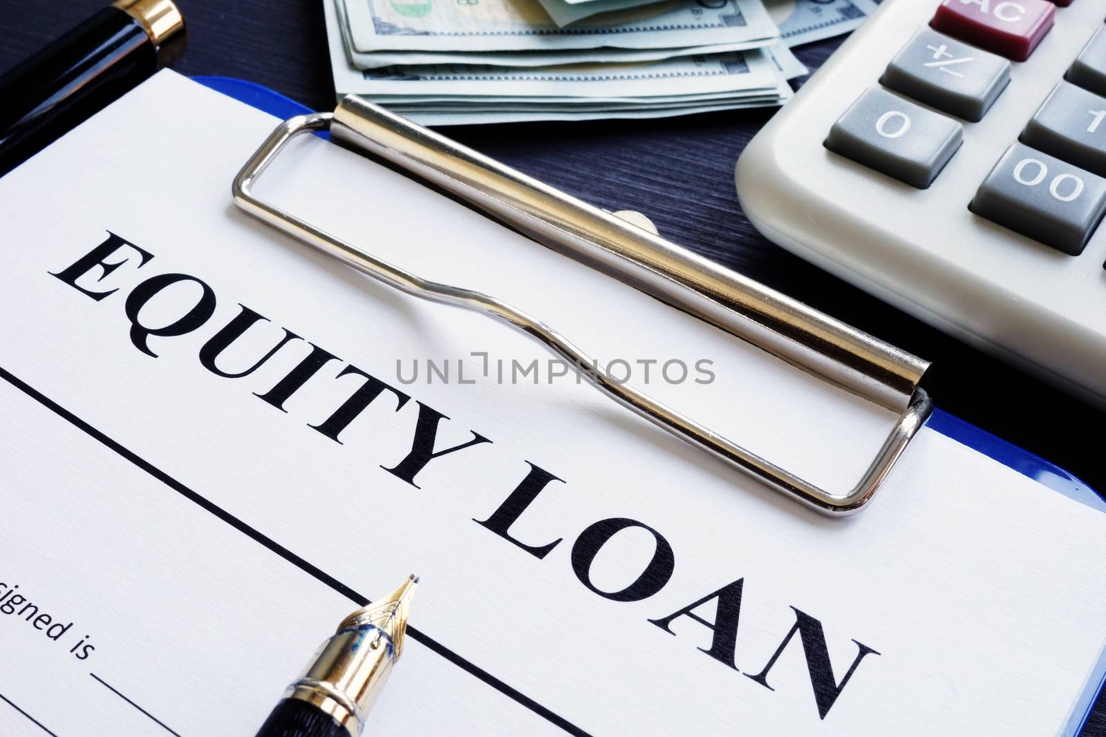Equity loan application, pen and calculator.