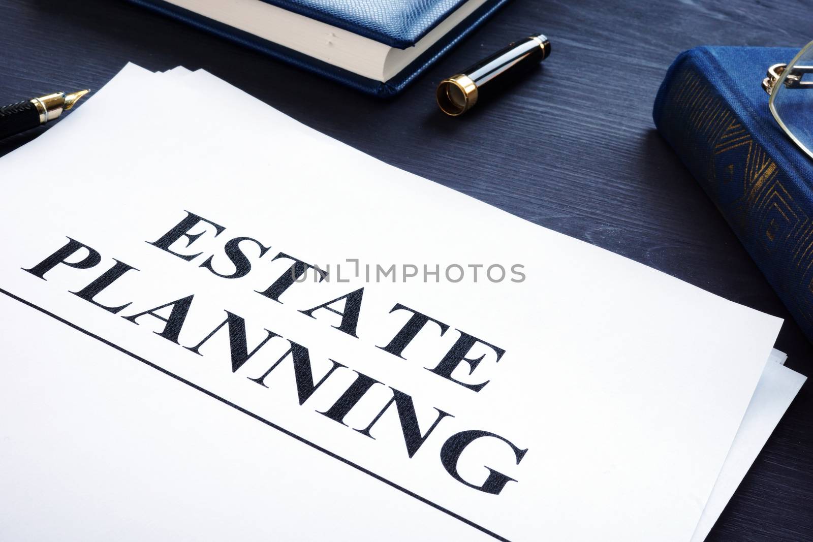 Estate planning documents on a desk. The will concept.