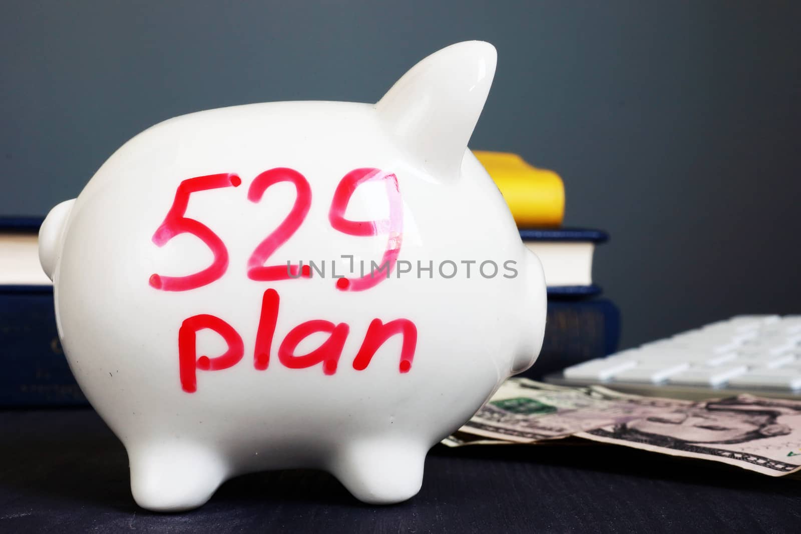 529 plan written on a piggy bank. College savings plan.