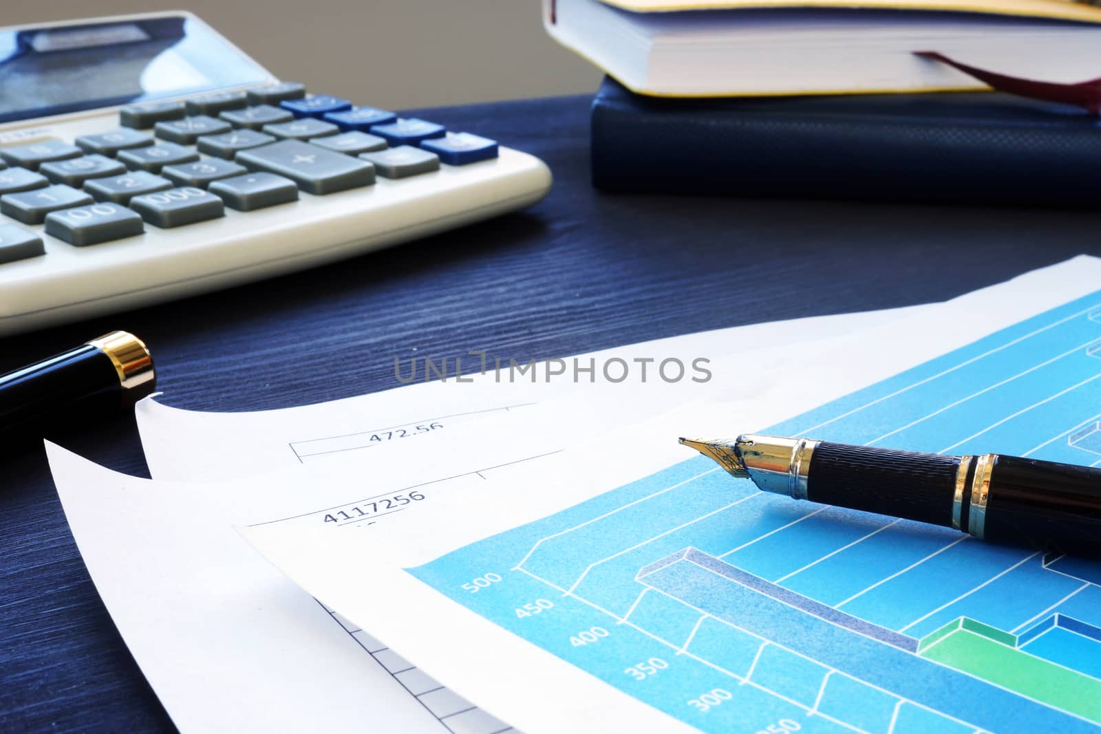 Business papers on an office desk. Financial report.