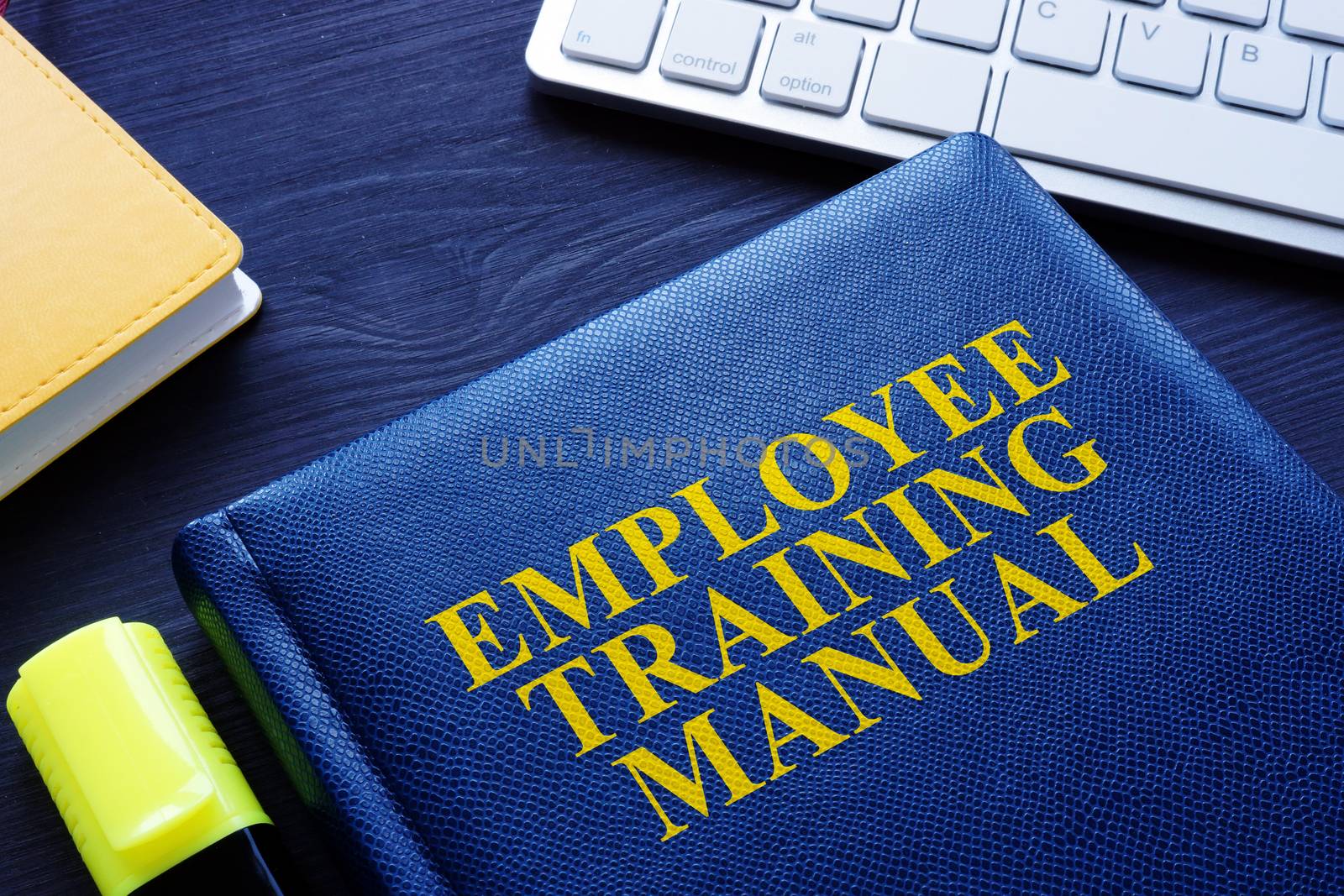 Employee Training manual on an office table.