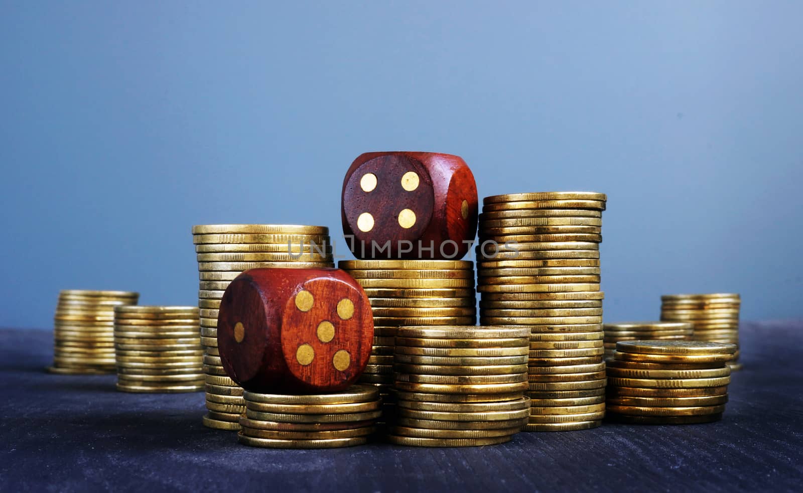 Stacks of coins and dices. Trading and uncertainty in business. Financial risk.