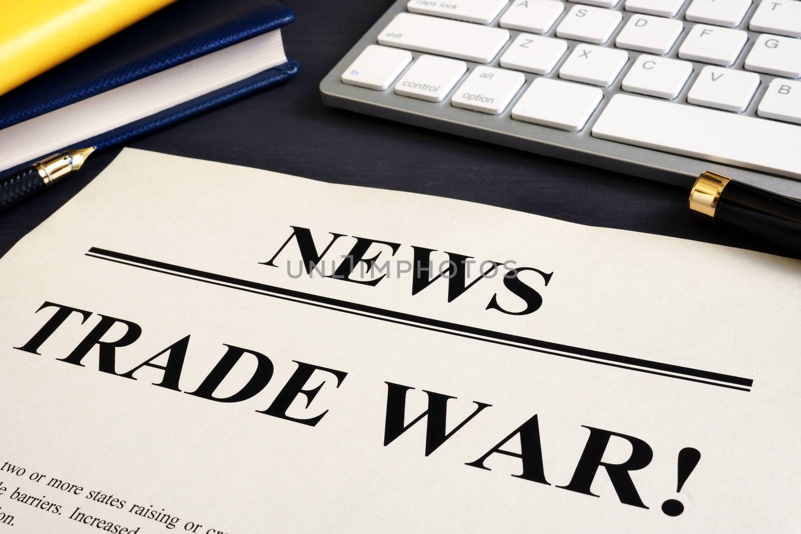 Newspaper with title Trade war on a desk.