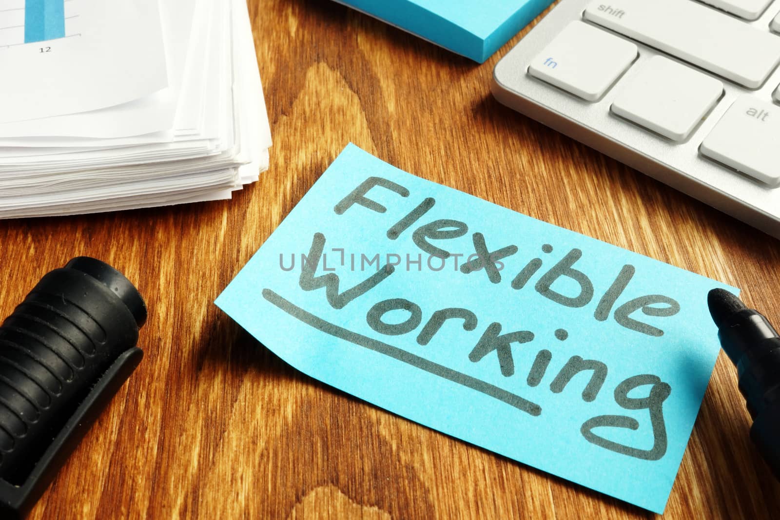 Flexible working policy concept. Piece of paper on table. by designer491