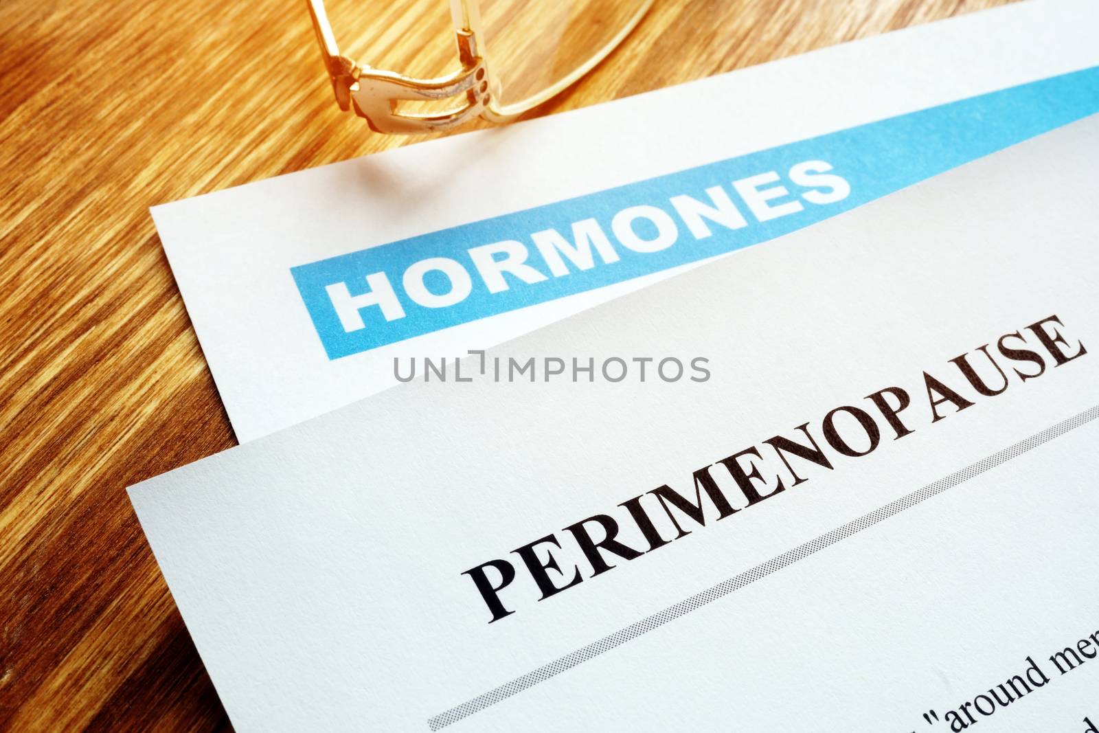 Perimenopause and menopause concept. Documents about hormones. by designer491