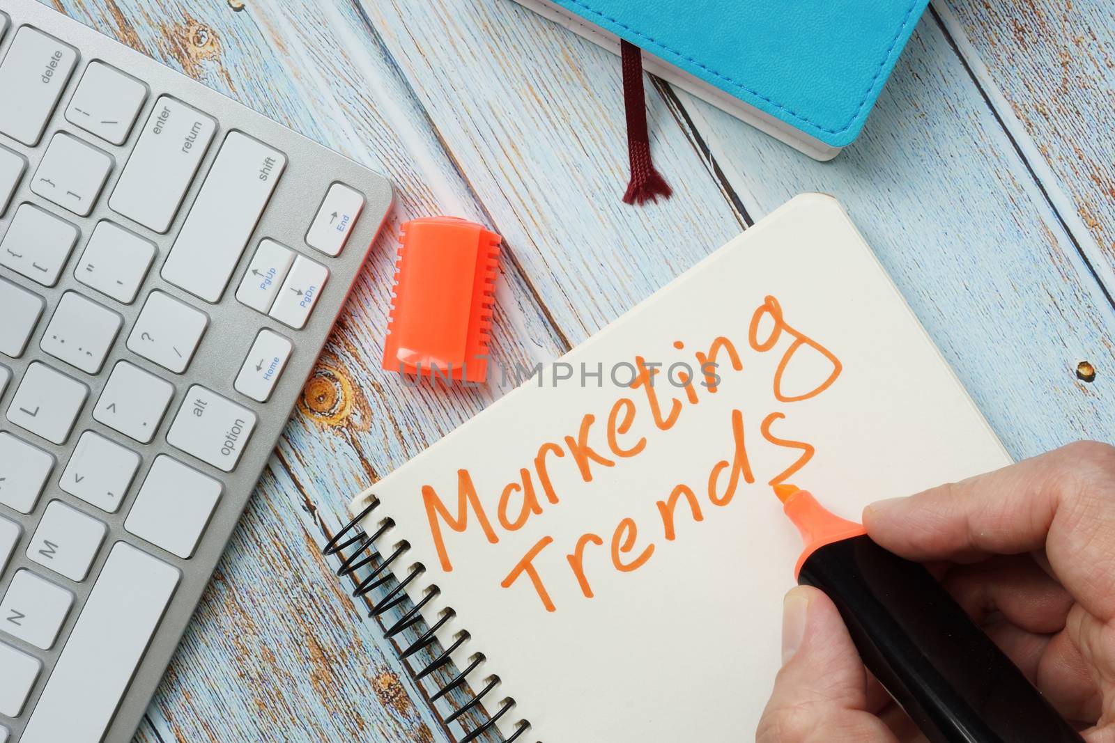 Man is writing marketing trends. by designer491