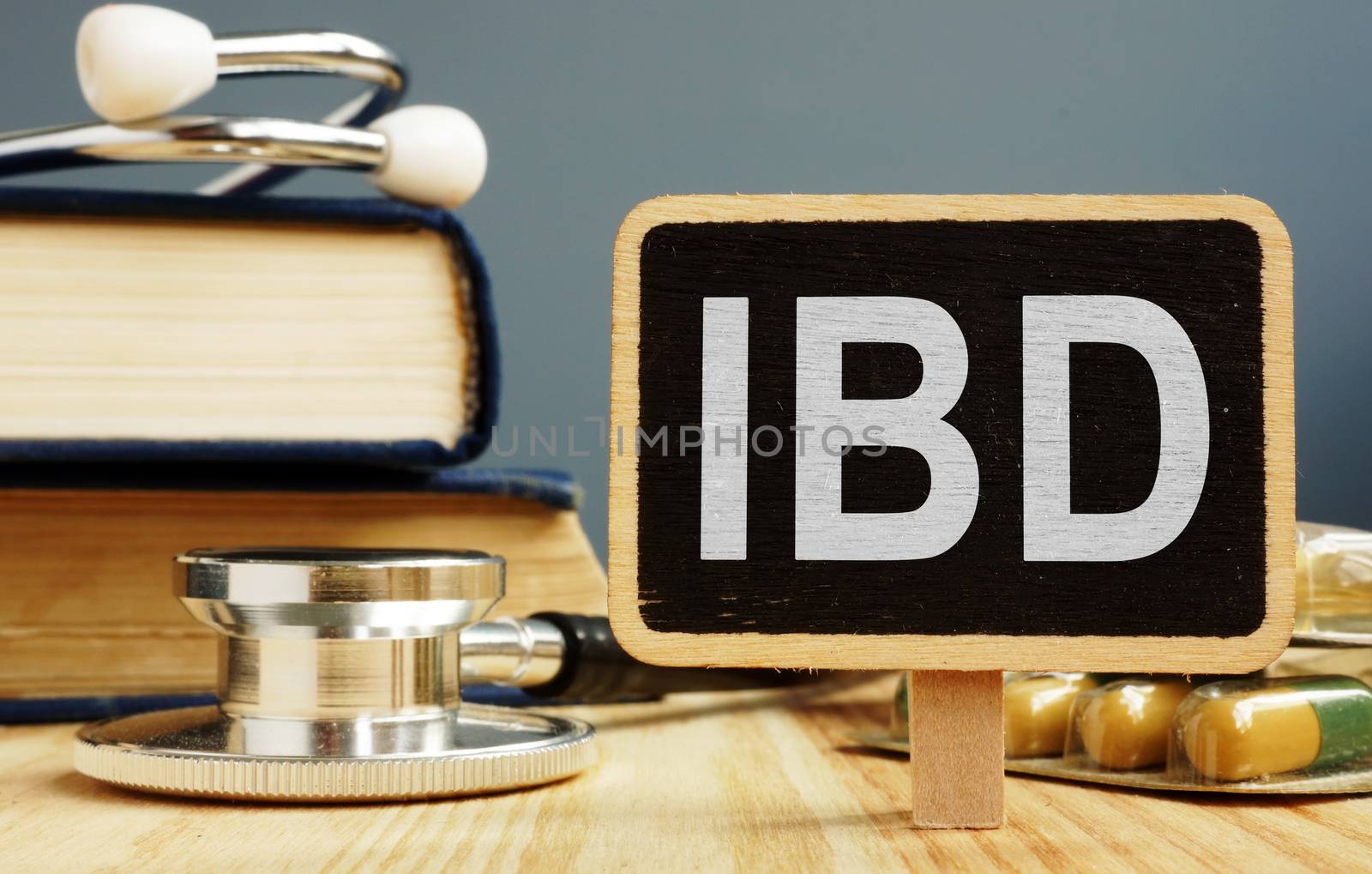 Blackboard with sign inflammatory bowel disease IBD and stethoscope. by designer491