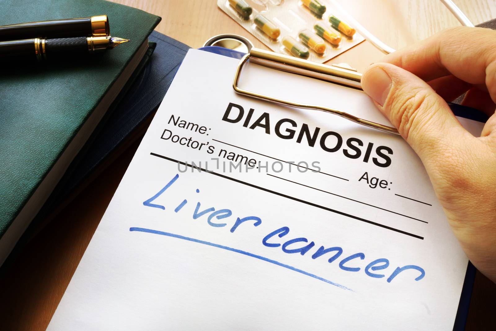 Liver cancer diagnosis on a medical form. by designer491