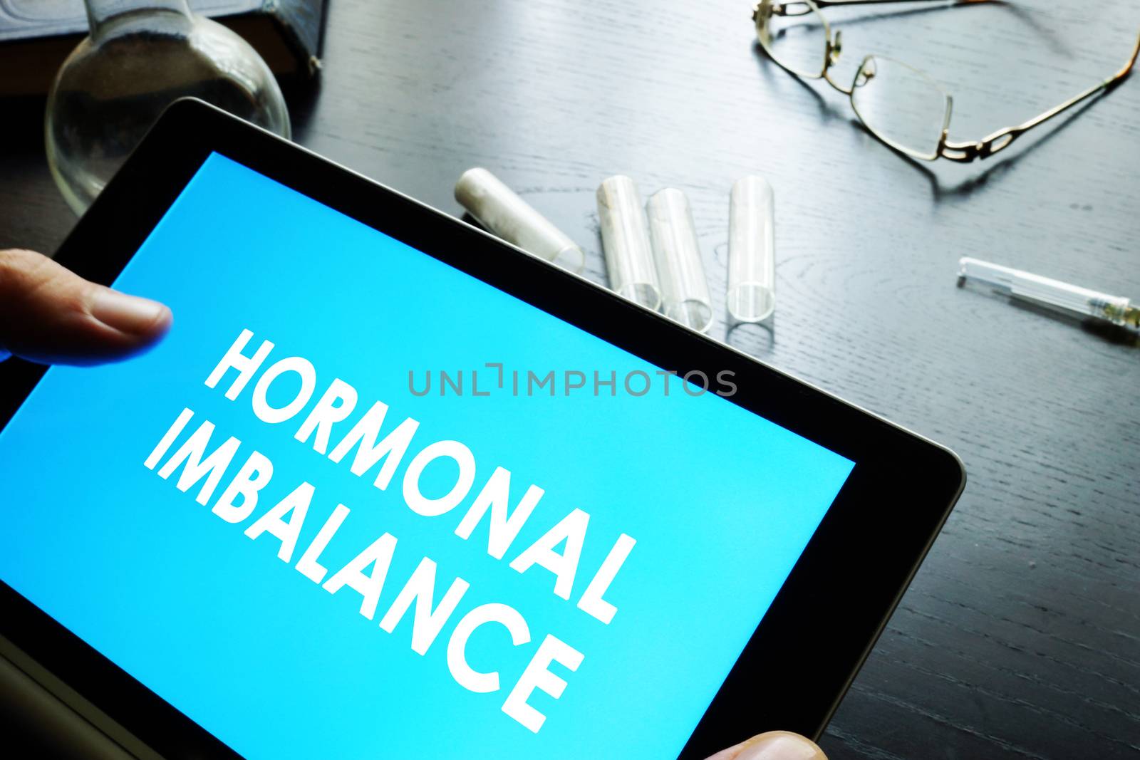 Hormonal imbalance sign on a tablet. by designer491