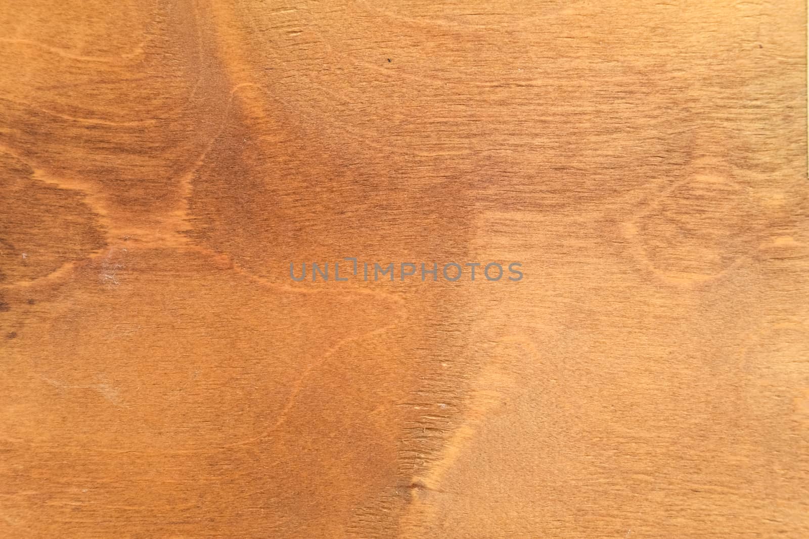 The background texture of the wood plywood is old yellowed.