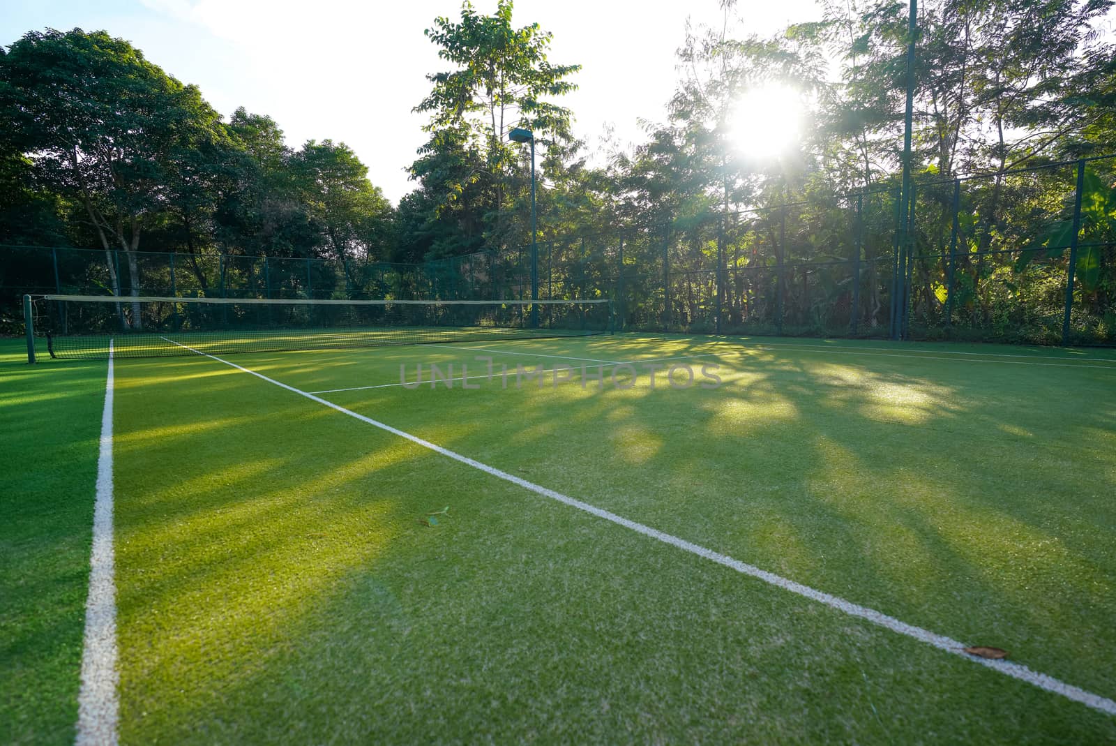 Beautiful scenery View of artificial grass tennis court.
