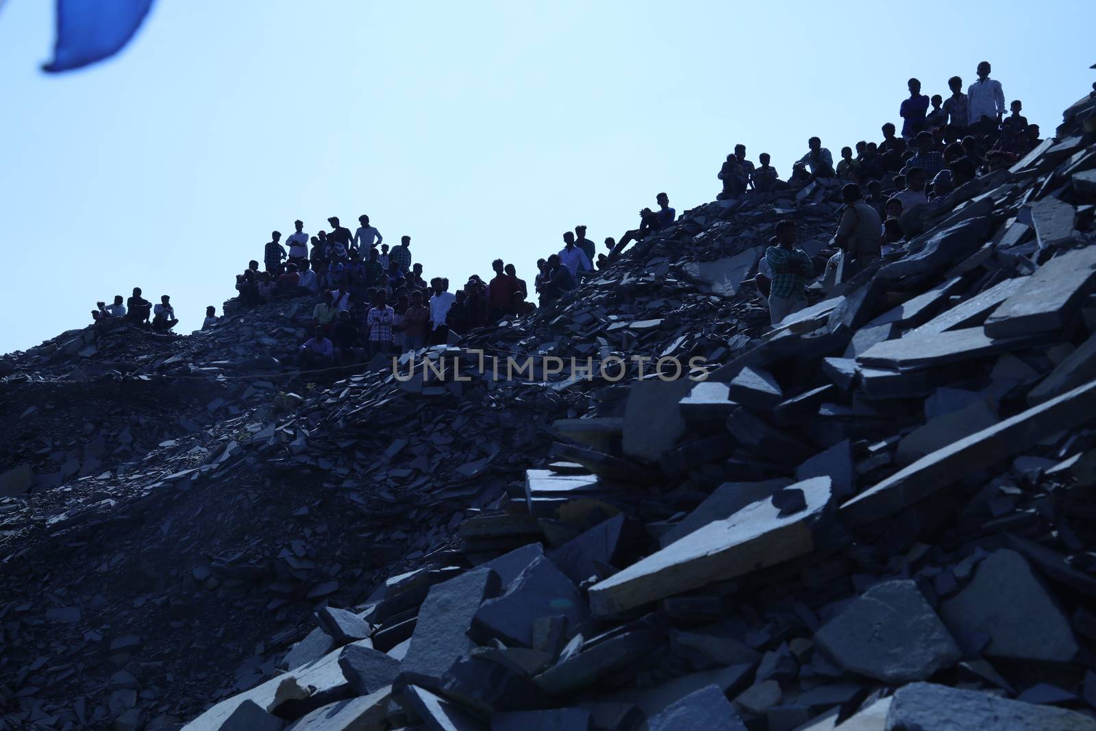 Silhouette of people on hill