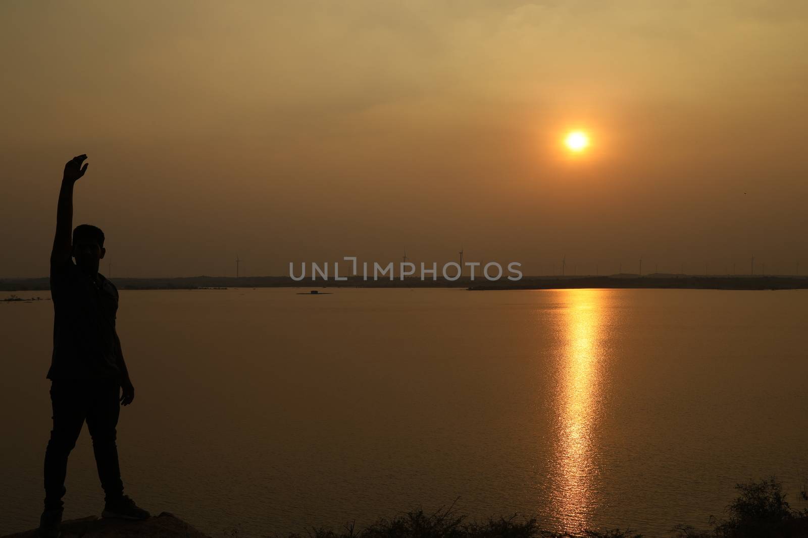 Silhouette of people on hill