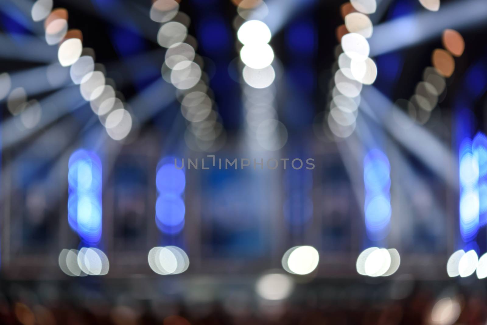 Abstract blurred background of the entertainment show lights with bokeh effect.