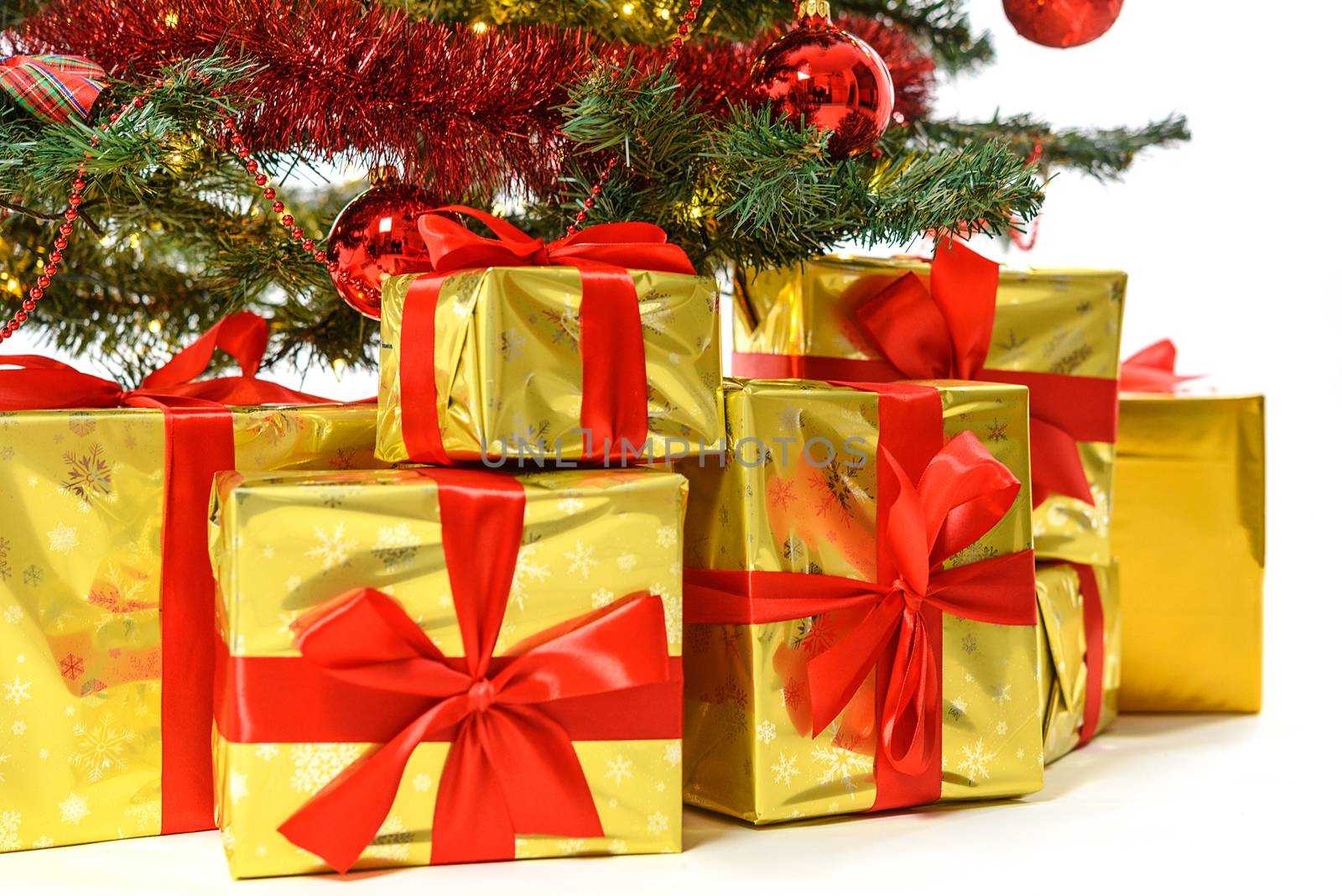 Luxury gifts under Christmas tree by wdnet_studio