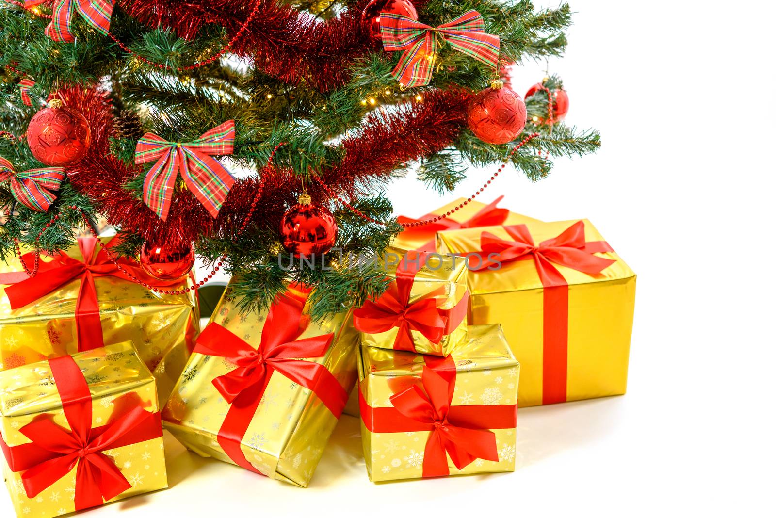 Luxury gifts under Christmas tree by wdnet_studio