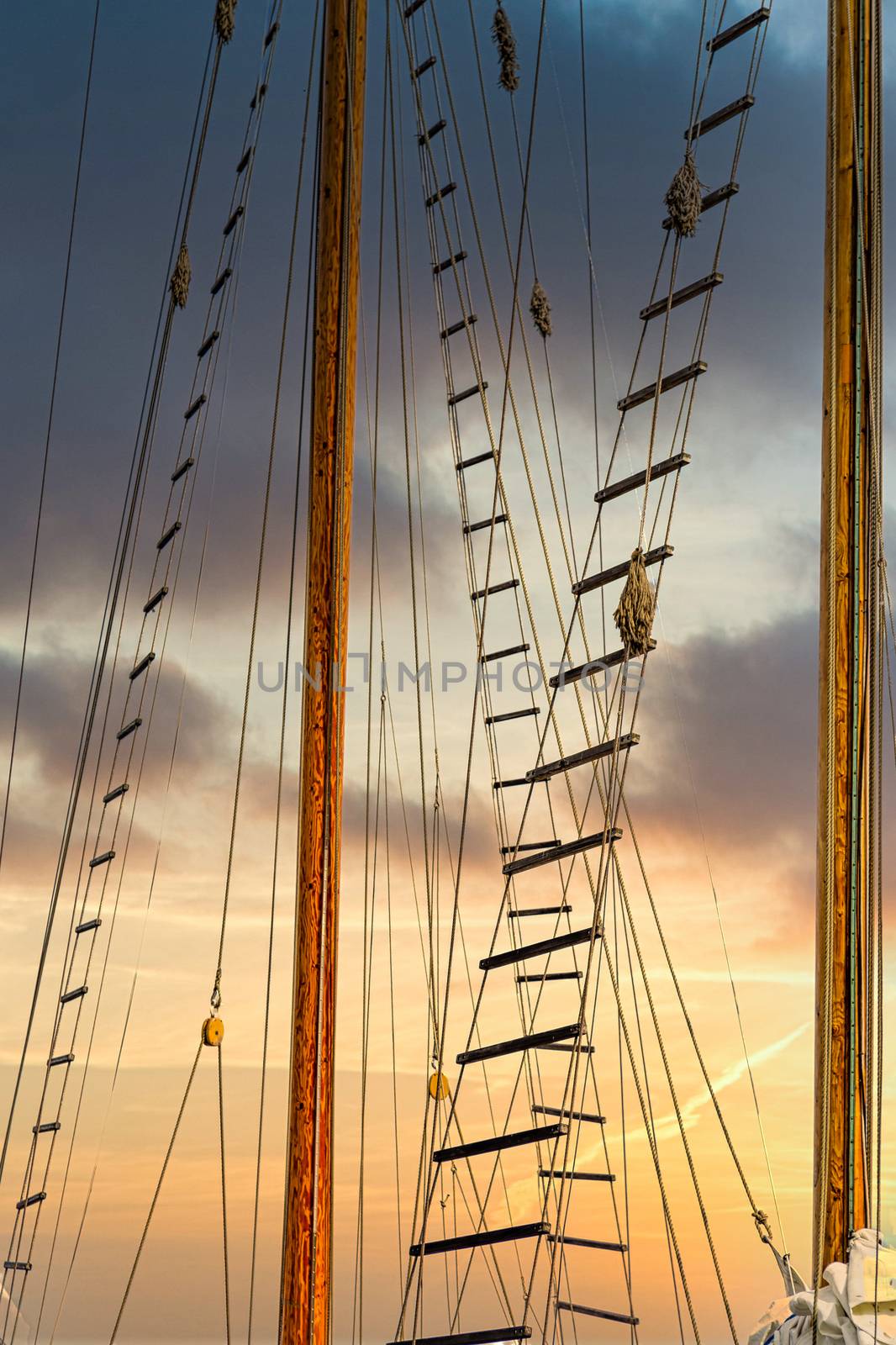Jacobs Ladders on Masts at Sunset by dbvirago
