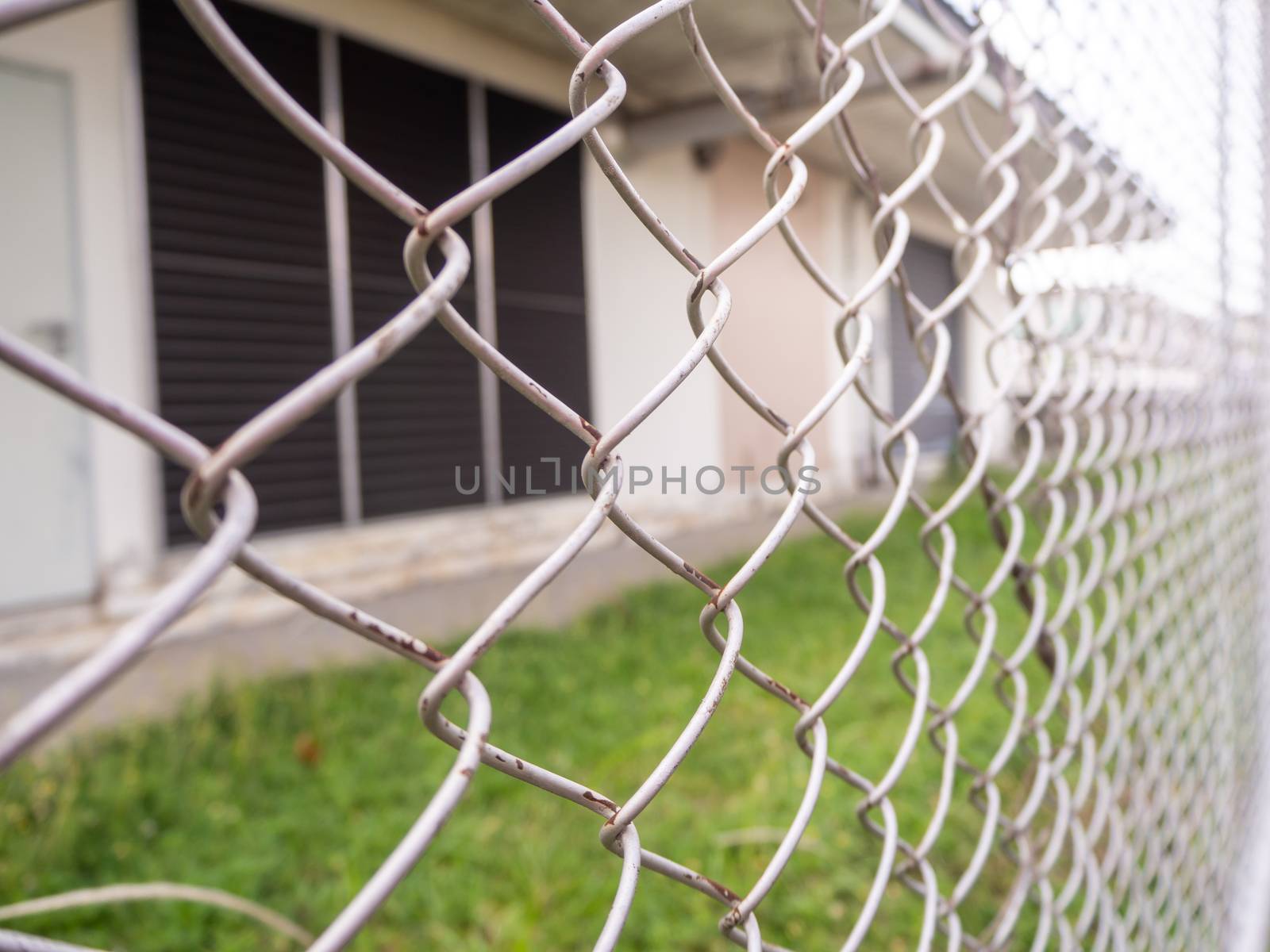 Wire fencing beside each other, the line between the road