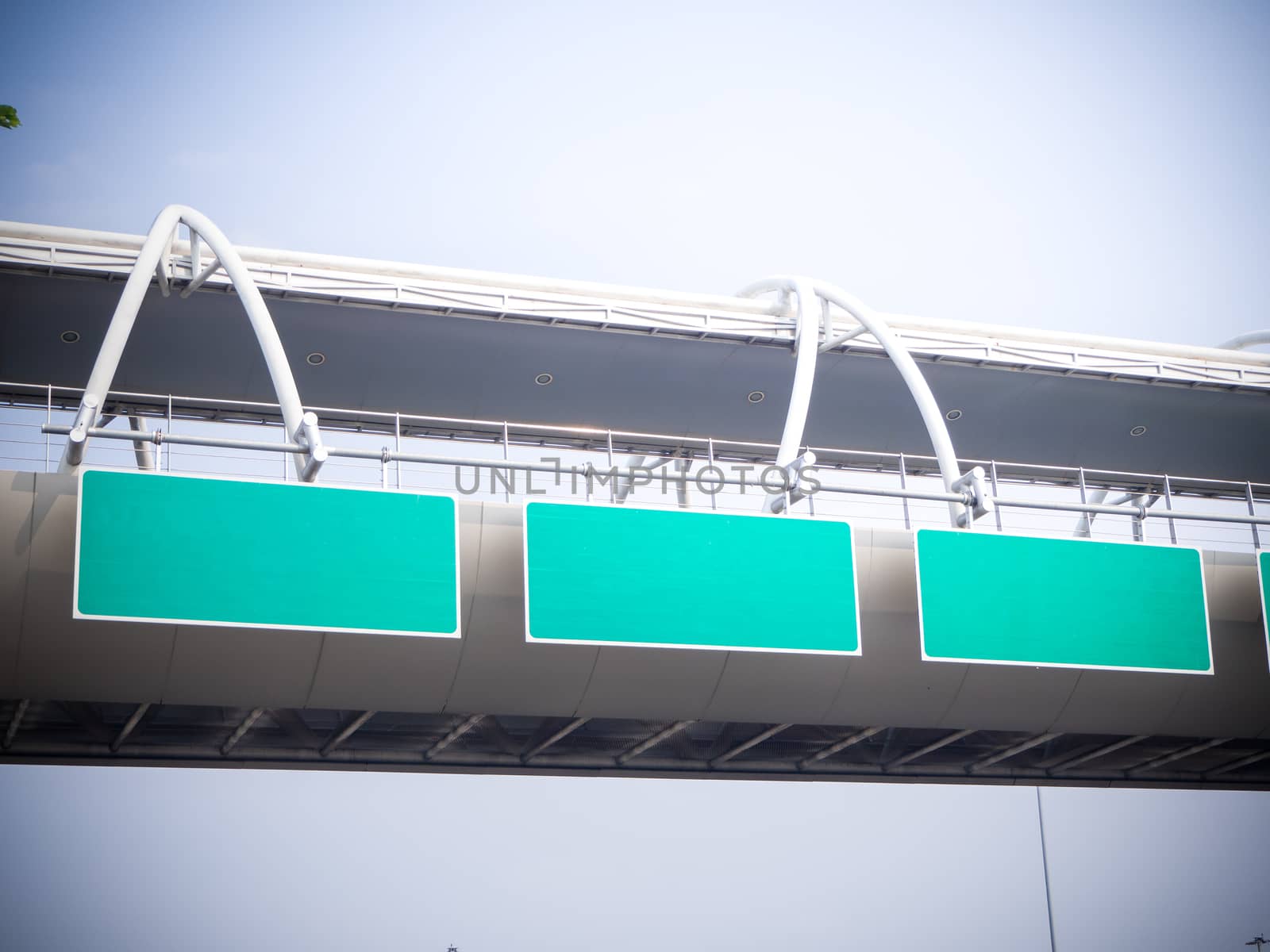 Green background labe on the bridge and blue sky background