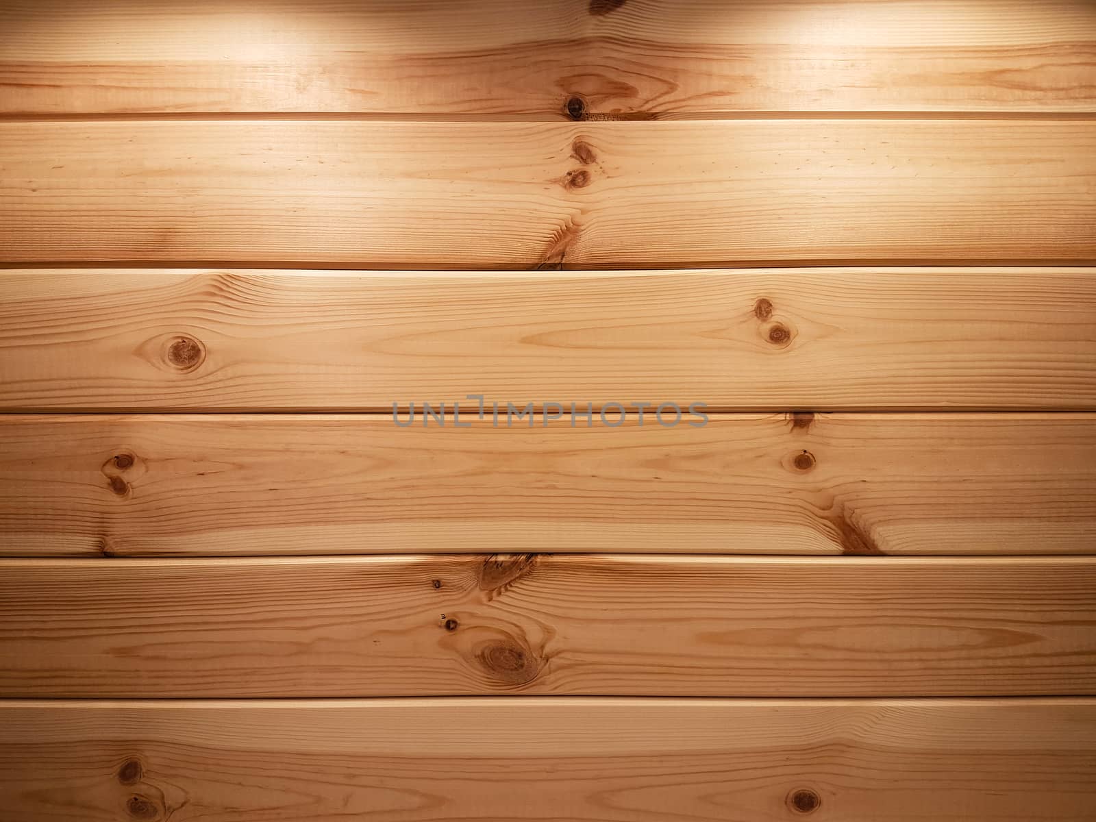 Beautiful wooden background - natural spruce planks with two backlights illuminated from above as a texture (high details).