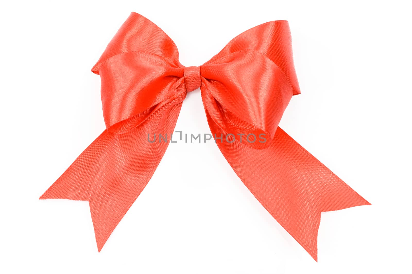 Shiny red satin bow on a white background in close-up ( high details)