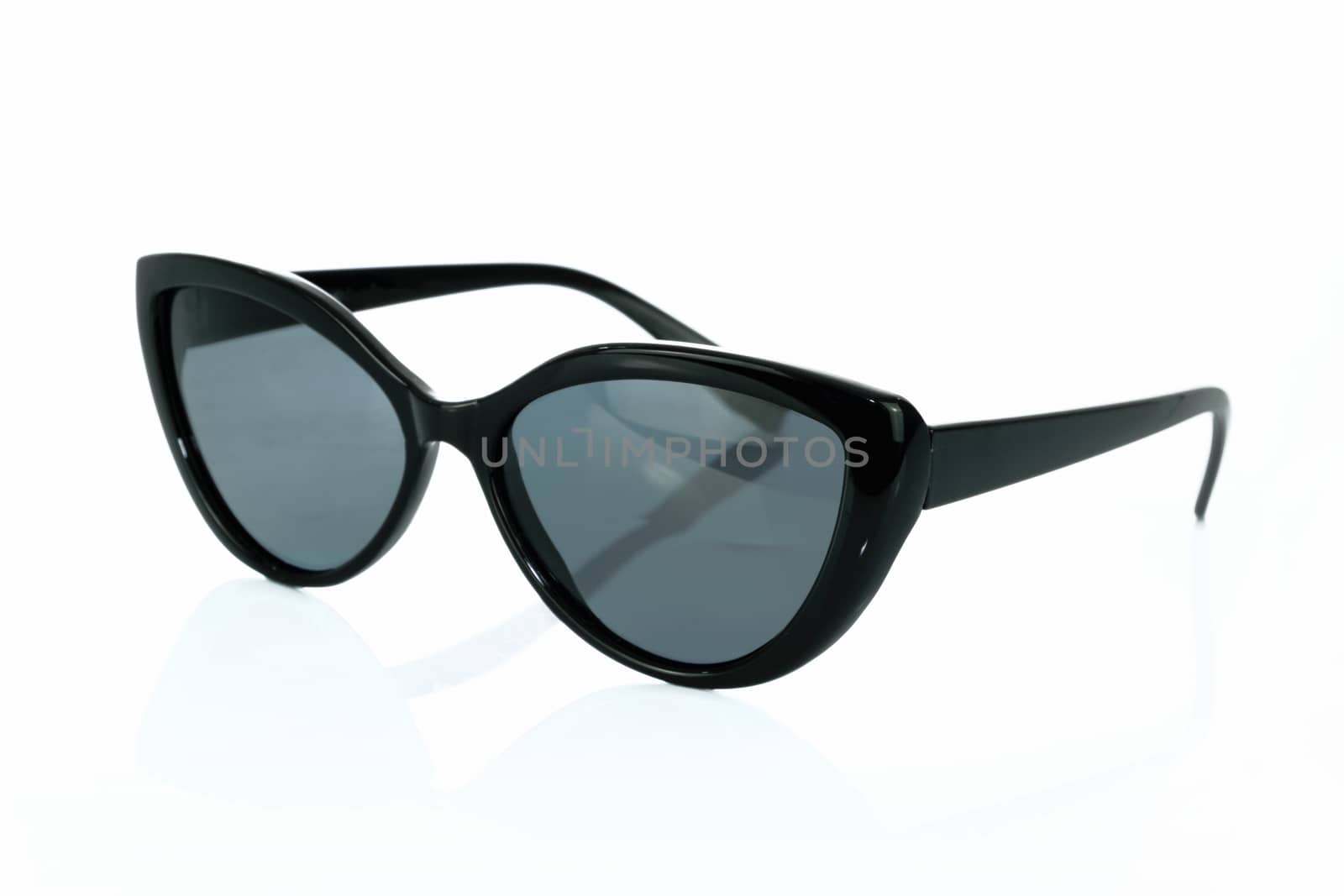 Trendy fashionable black sunglasses isolated on white background in close-up