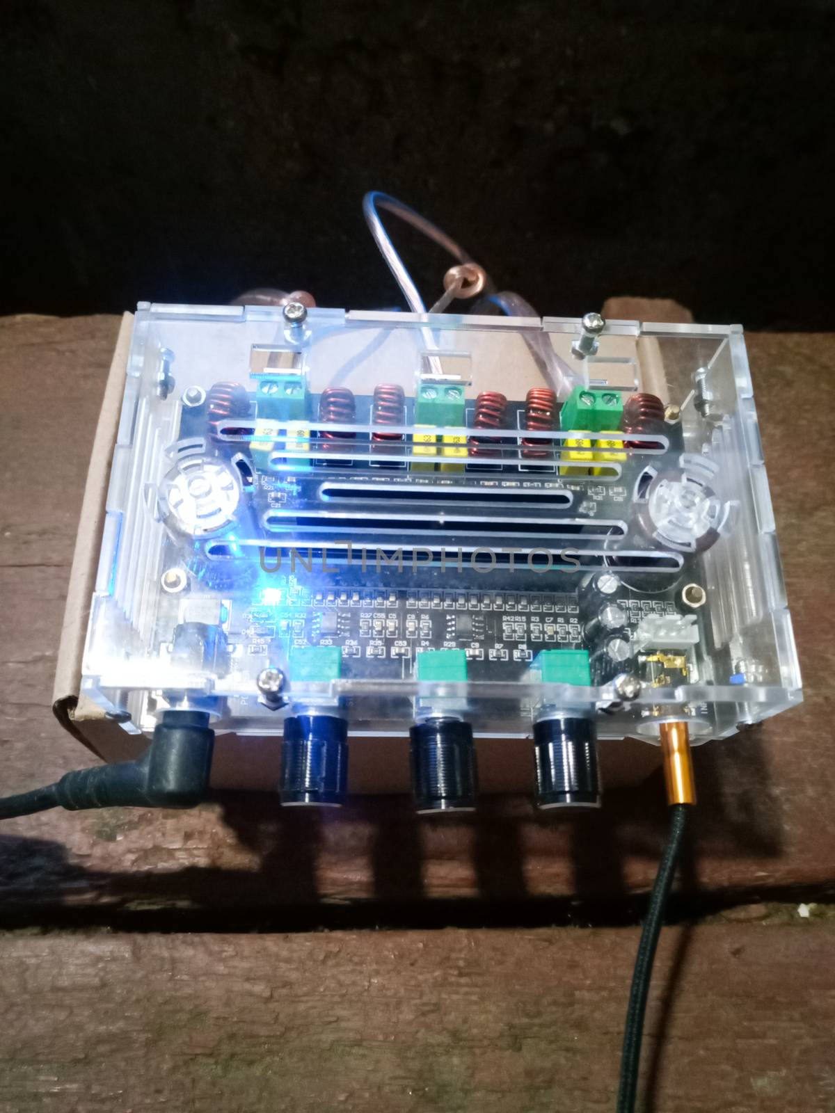 A small musical power amplifier in a plastic case.