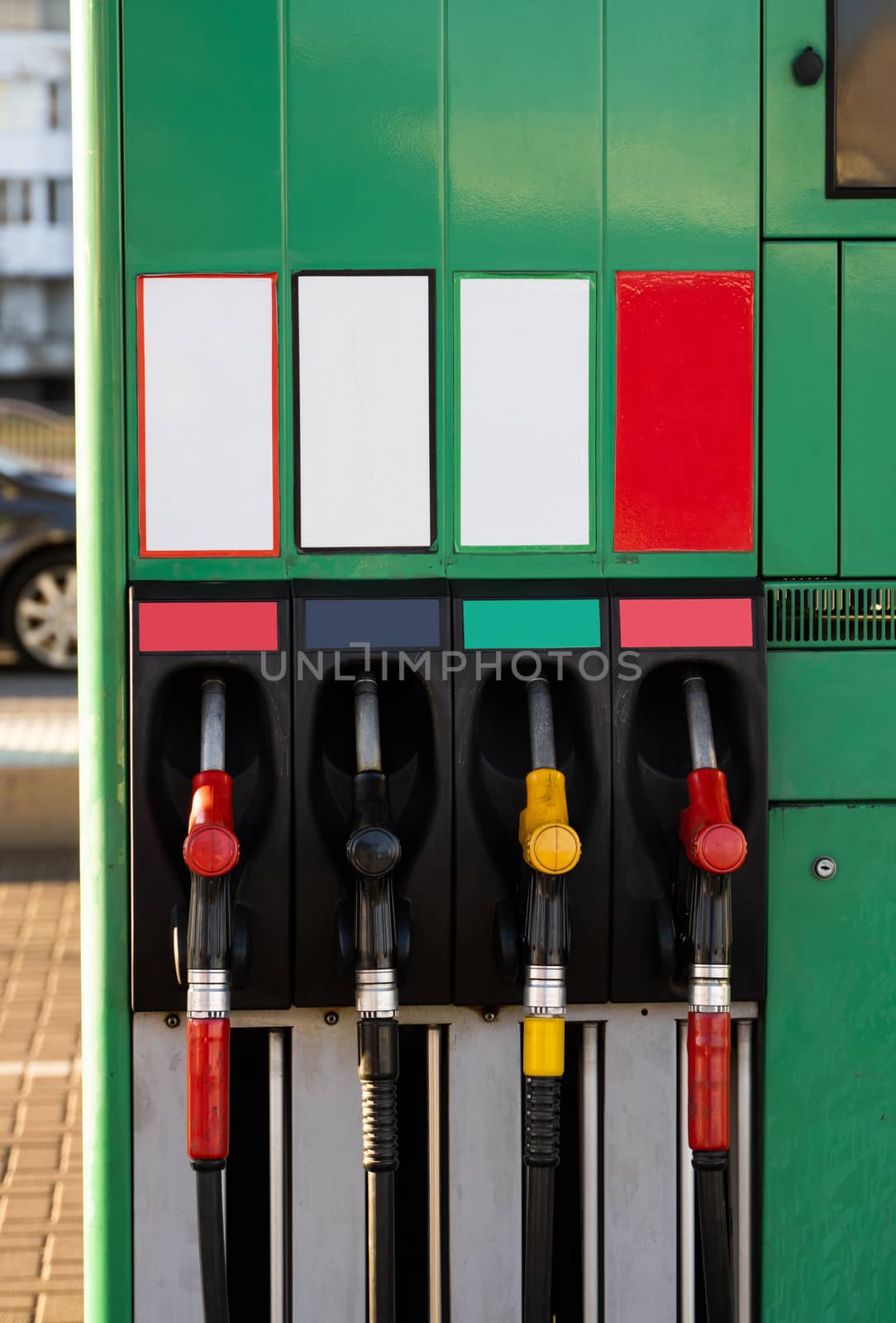 Four fuel pumps at a gas station