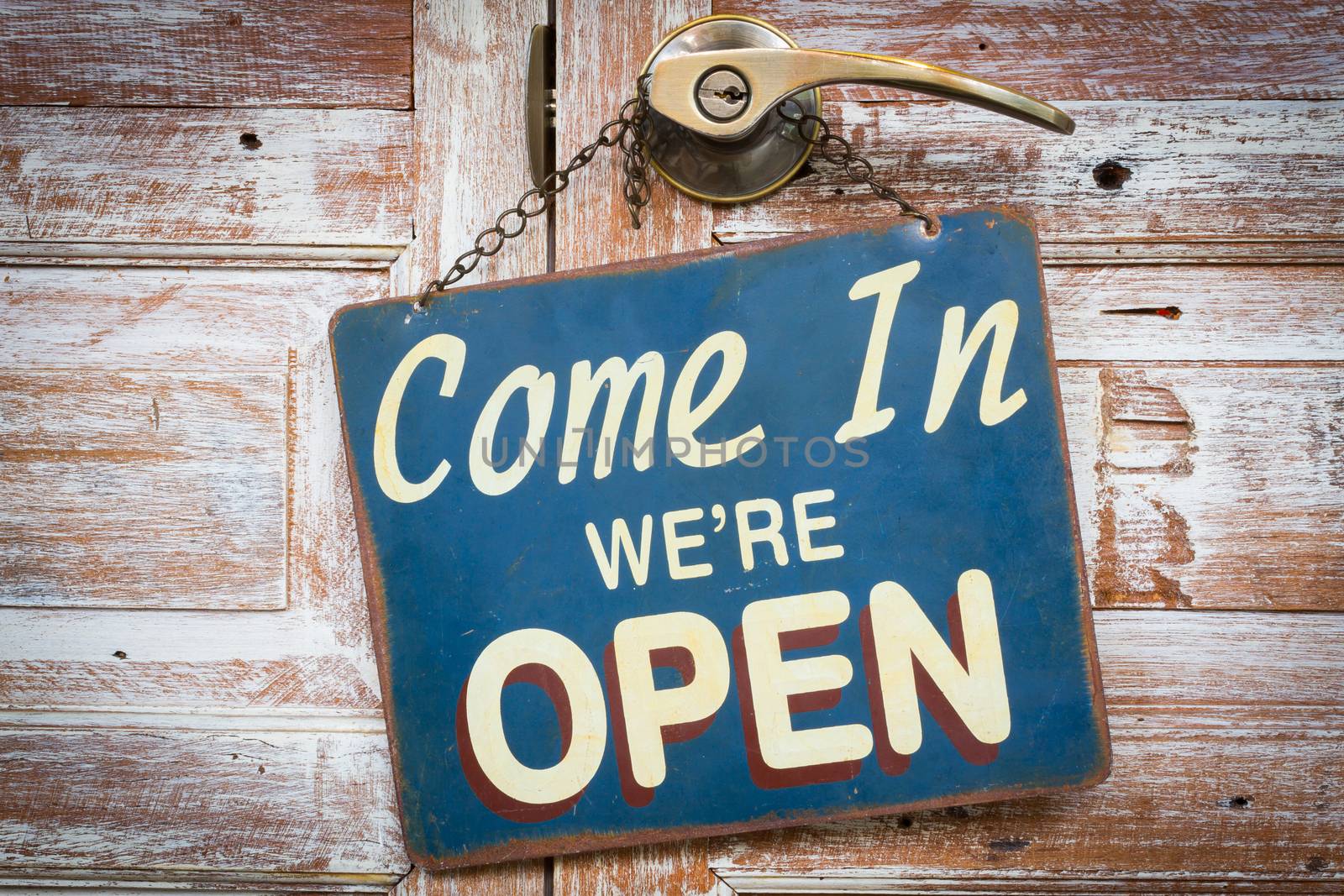 Come In We're Open on the wooden door, retro vintage style