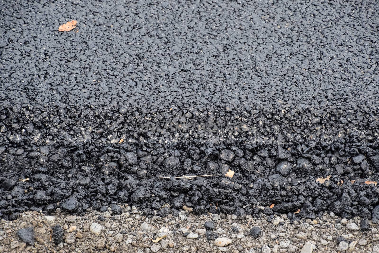 New fresh asphalt. edge of new road from the asphalt. by fedoseevaolga