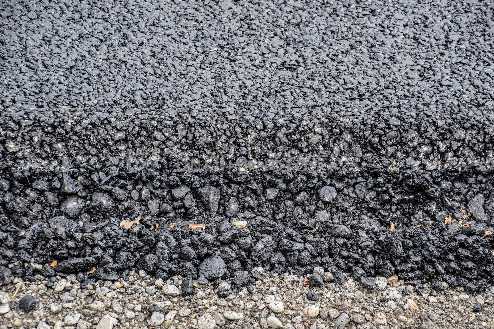 New fresh asphalt. edge of new road from the asphalt. by fedoseevaolga