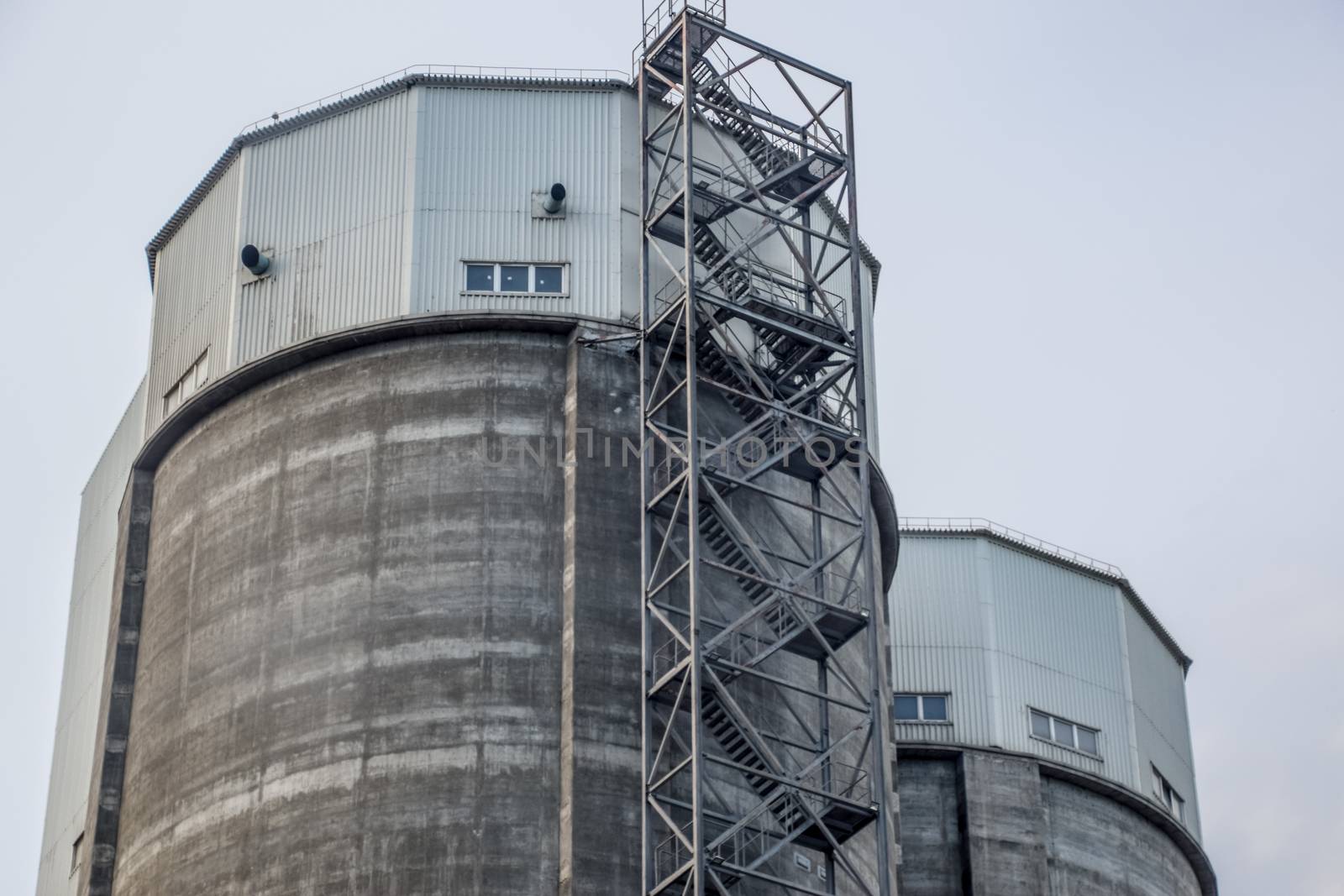 Staircase to the tower of a cement plant. Industry building.