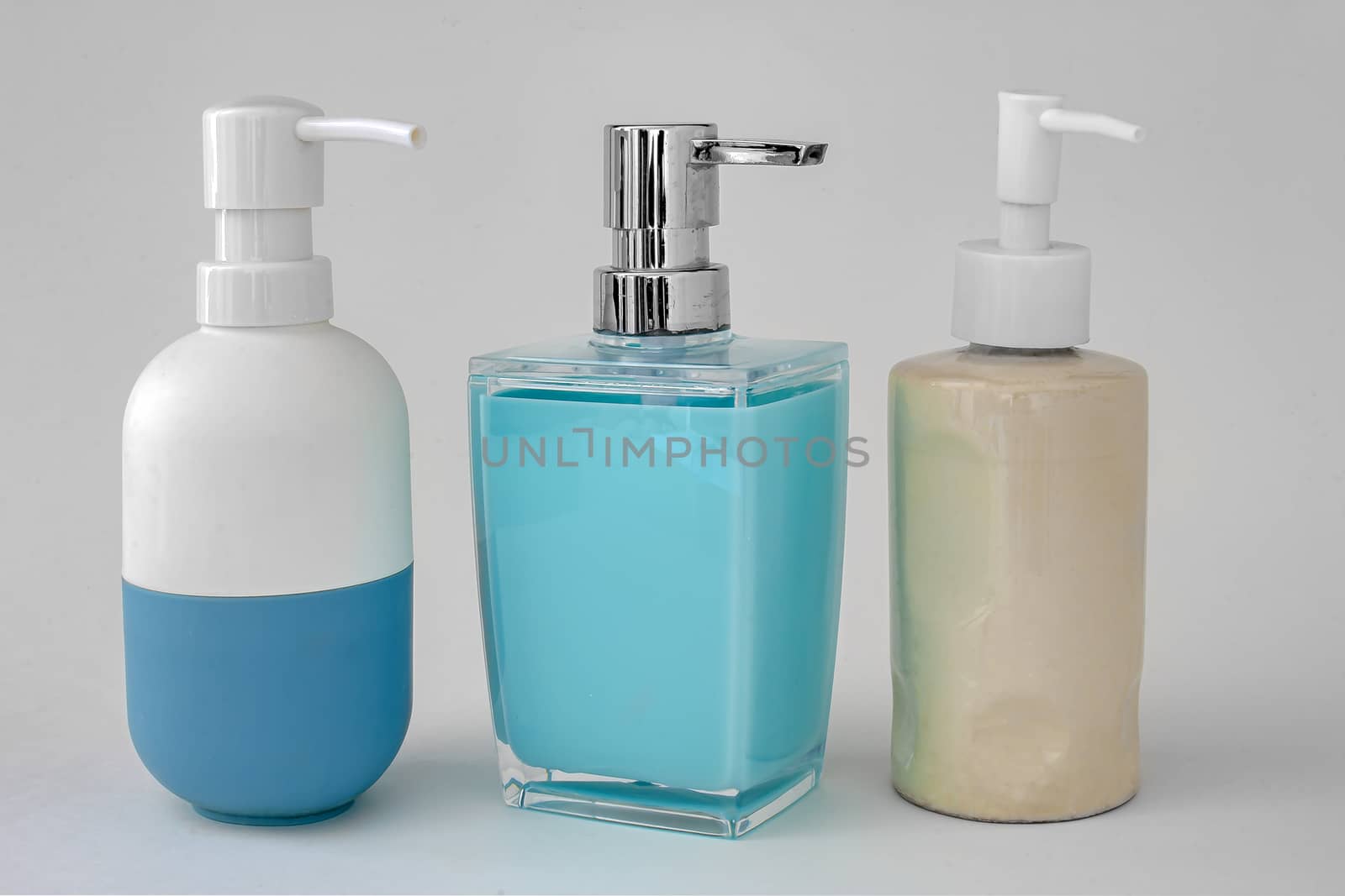 Colorful soap dispenser for bathrooms or kitchen sinks on a white background by oasisamuel